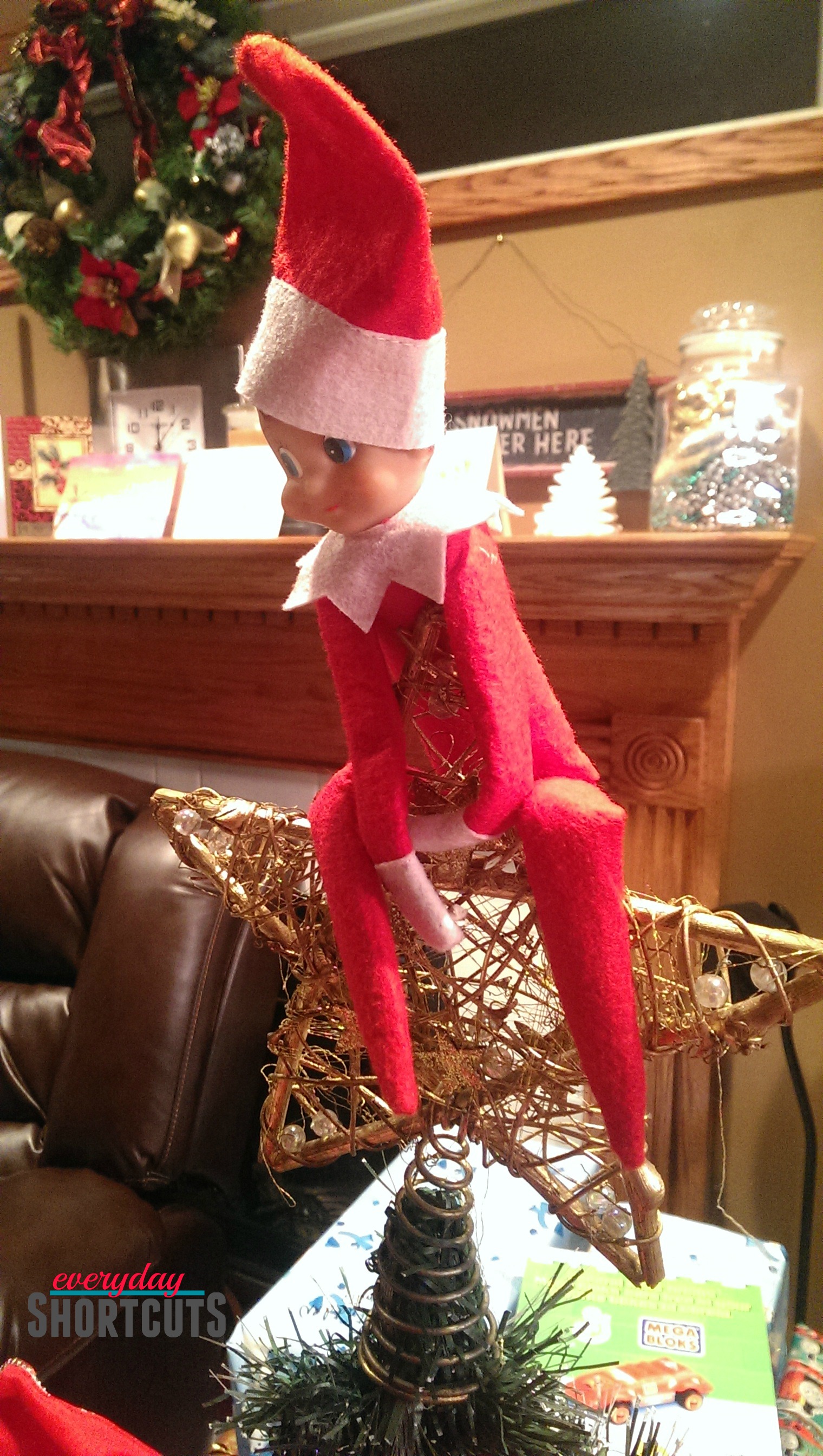 elf on the shelf on christmas tree star