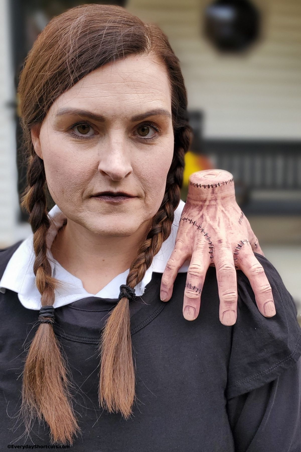 Addams family thing hand prop on shoulder