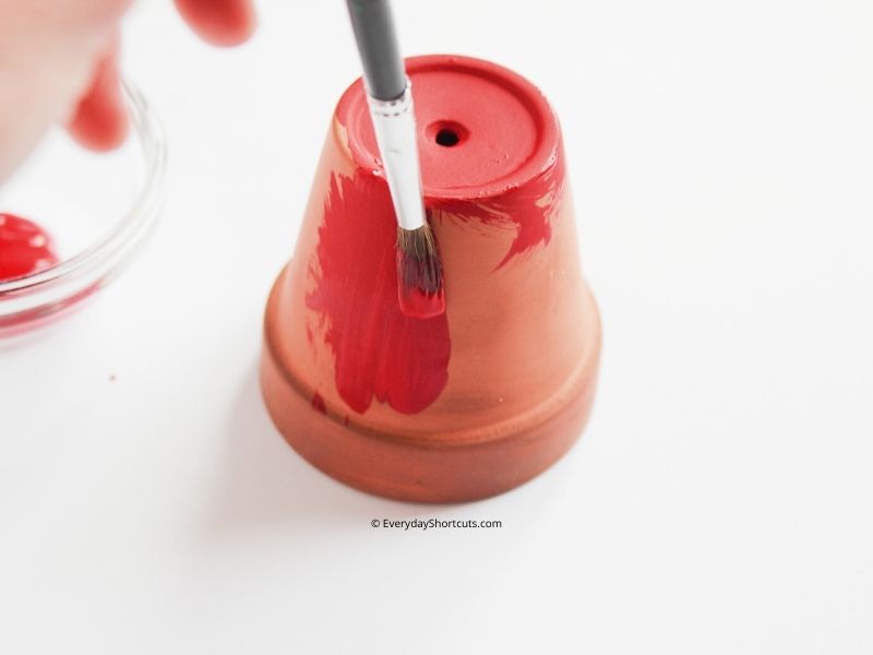 https://everydayshortcuts.com/wp-content/uploads/2021/09/paint-clay-pot-red-for-gumball-machine-ornament.jpg
