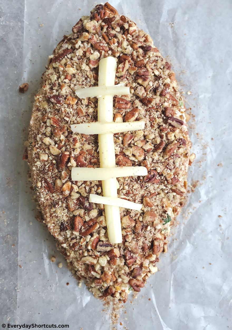football shaped cheese ball with pecans
