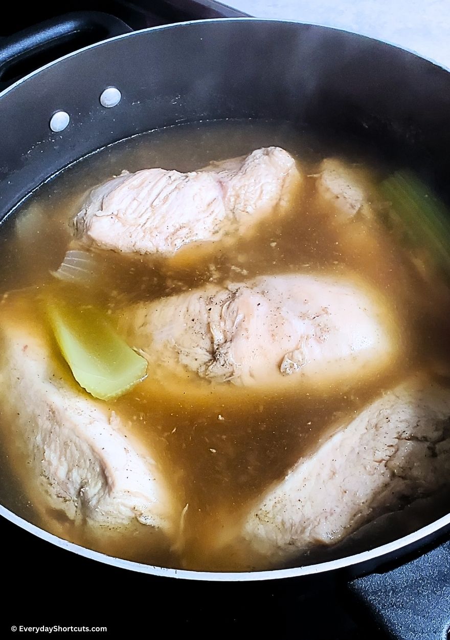 boiled chicken breasts in a pot