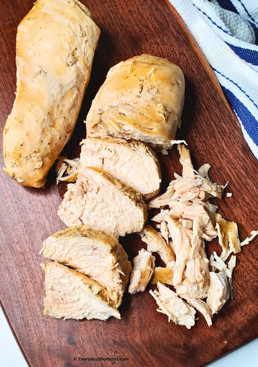 boiled chicken on a cutting board