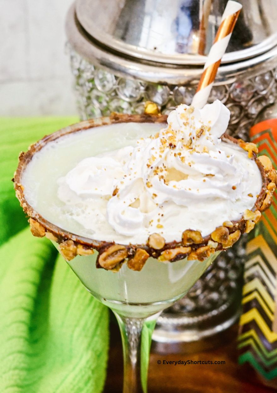pistachio martini with whipped cream on top