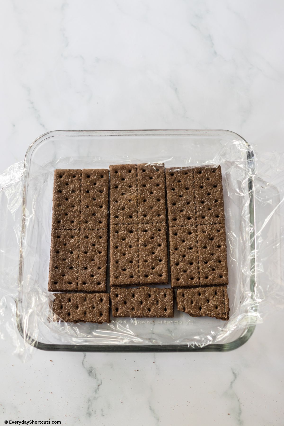 layer of chocolate graham crackers in a baking dish
