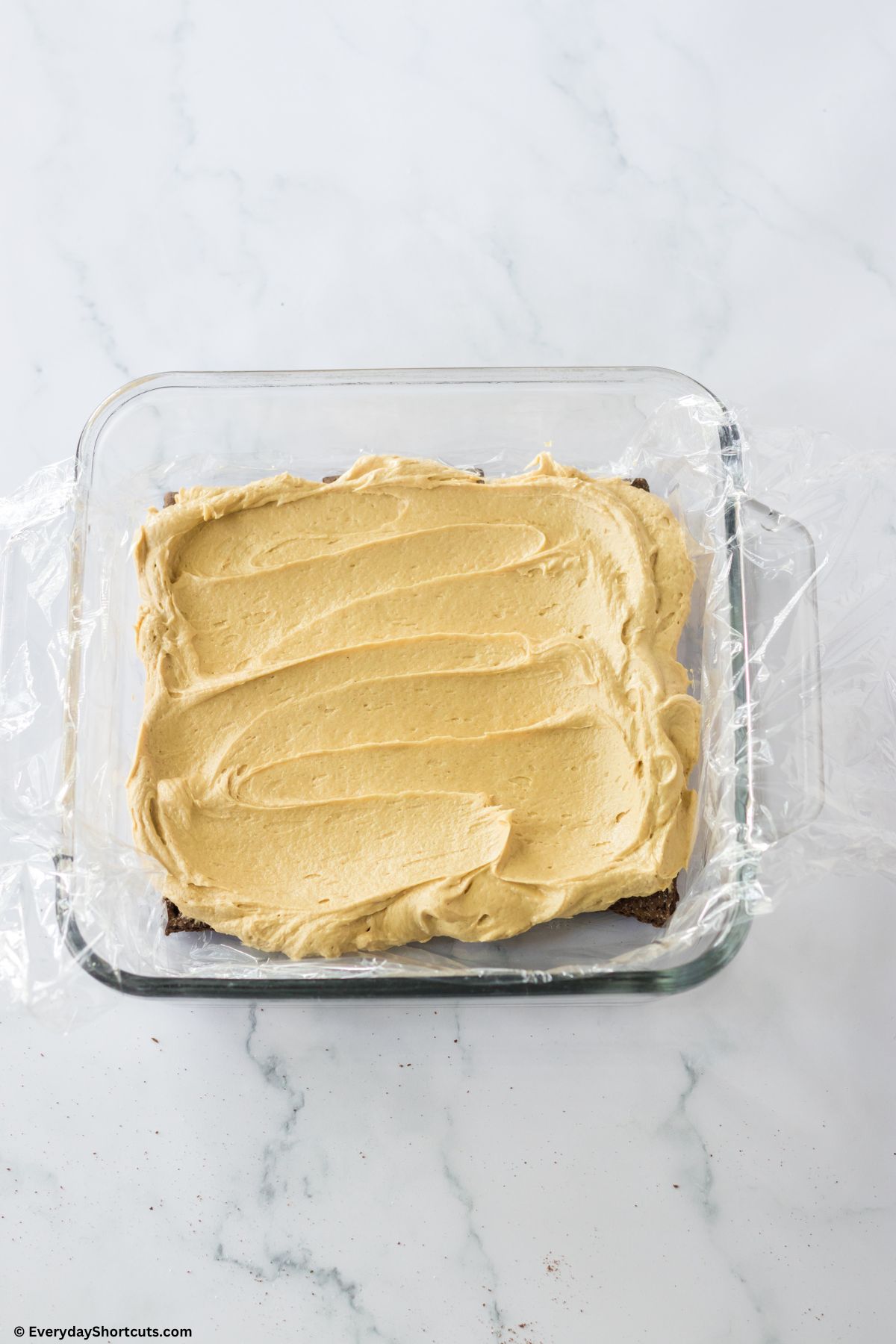 layer of peanut butter filling in a baking dish