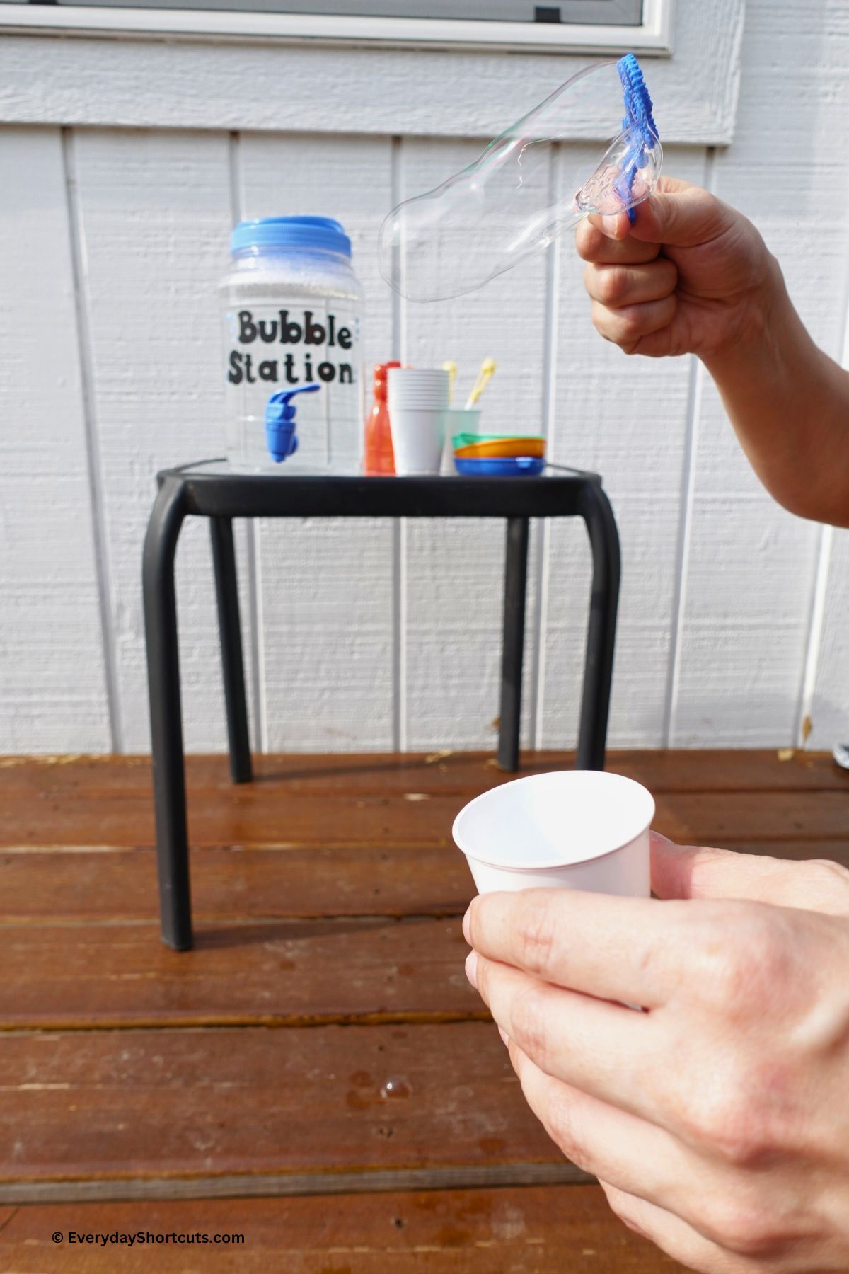 blowing bubbles with homemade bubble solution