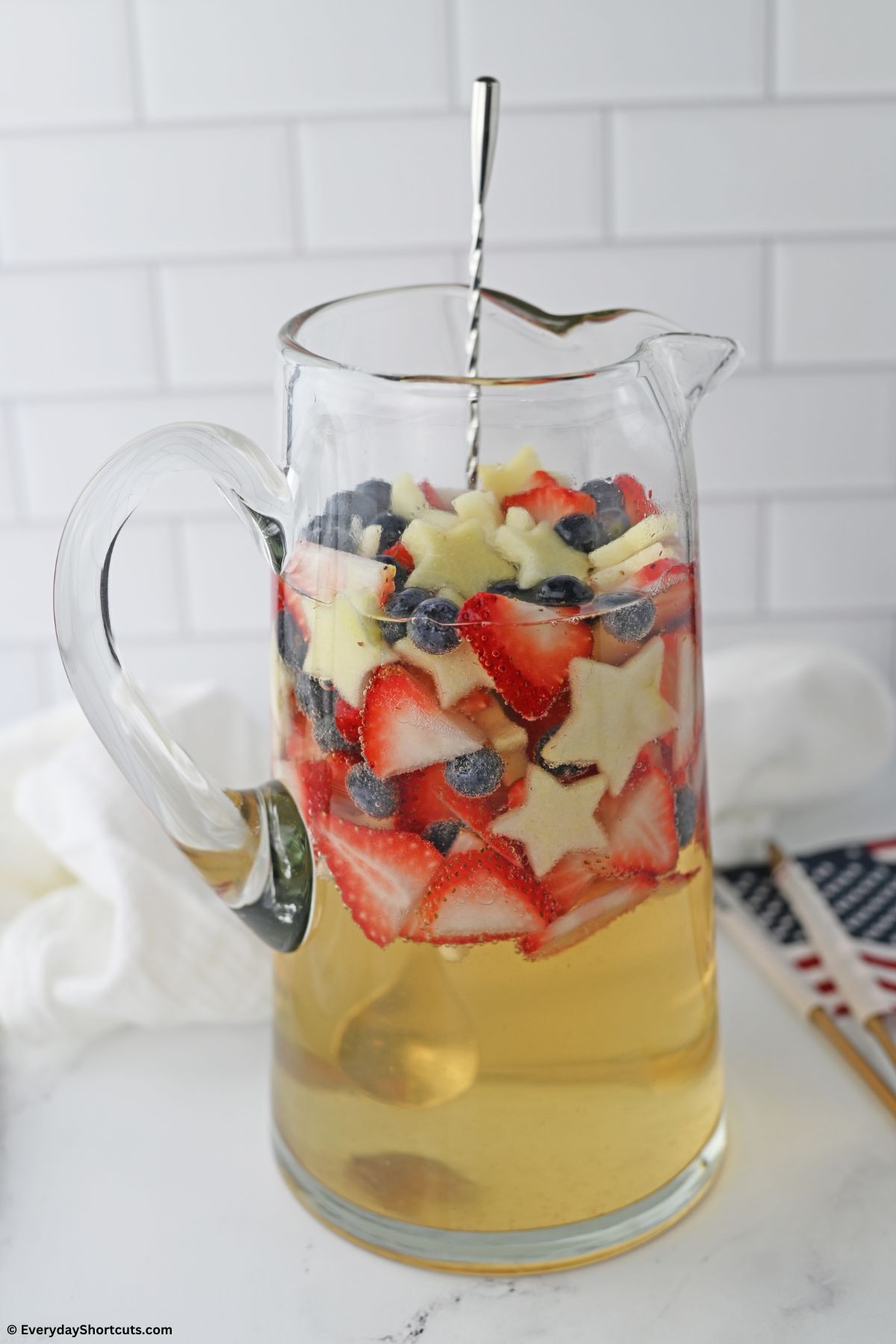 patriotic red white and blue sangria in a pitcher