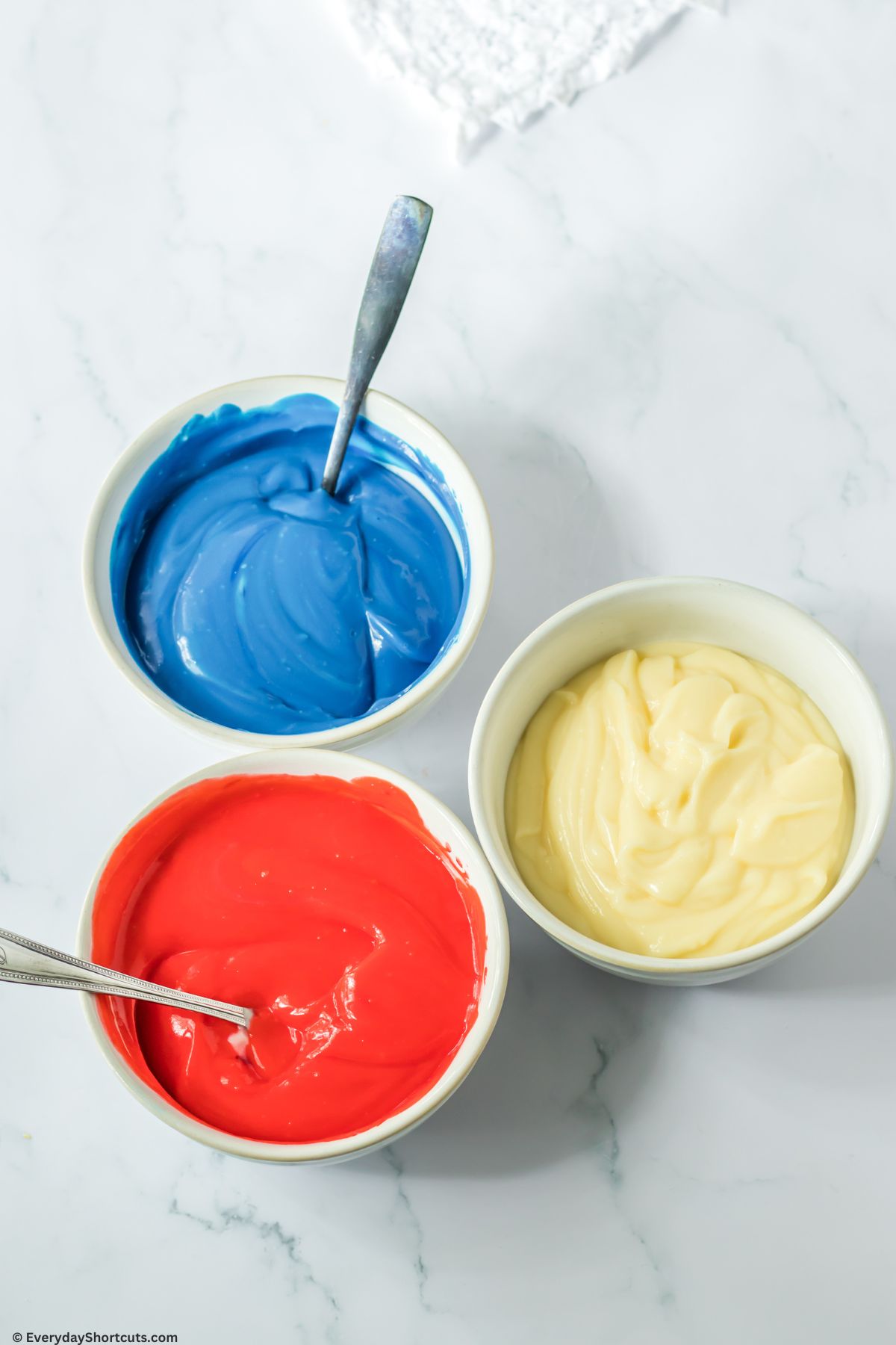 add food coloring to pudding bowls