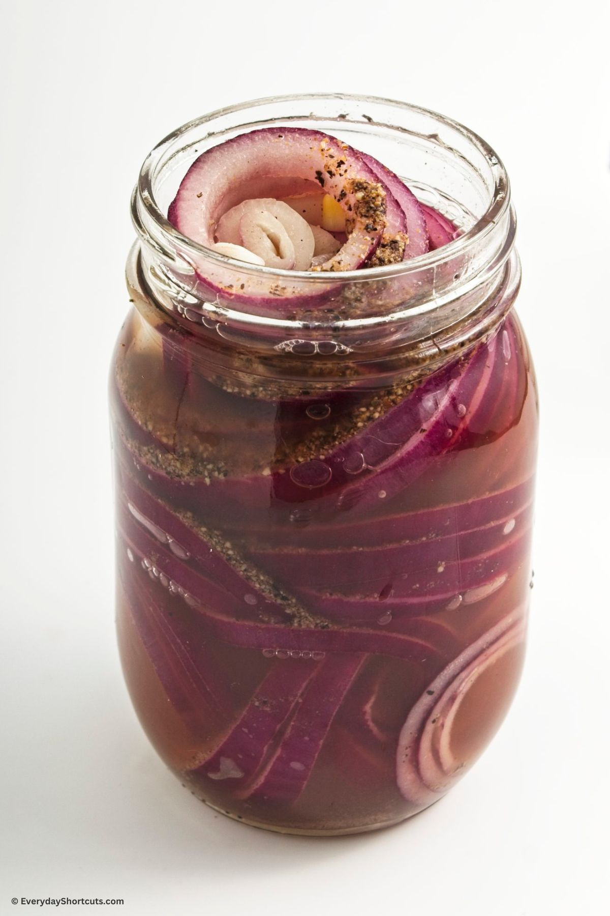 pickling mixture in a jar with onions