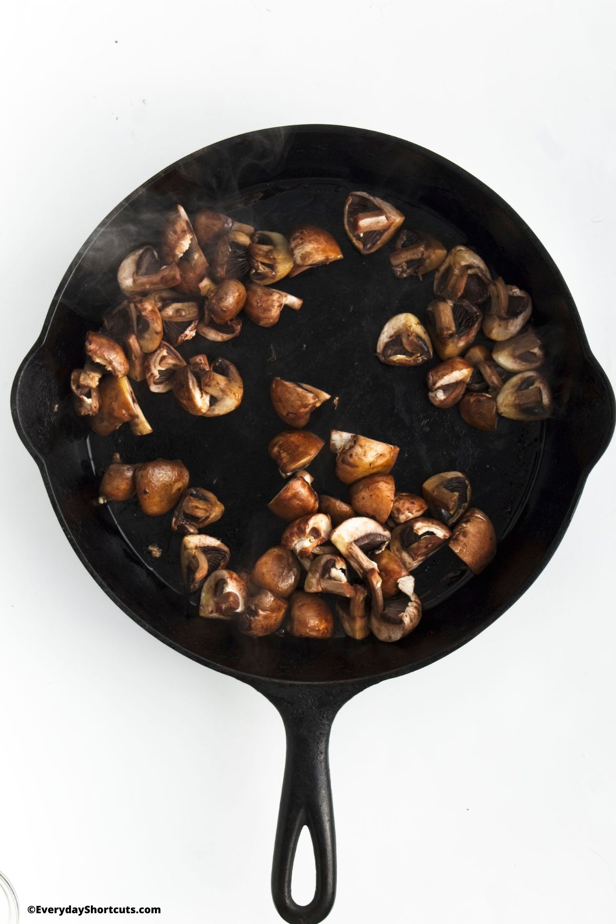 browned mushrooms in a cast iron