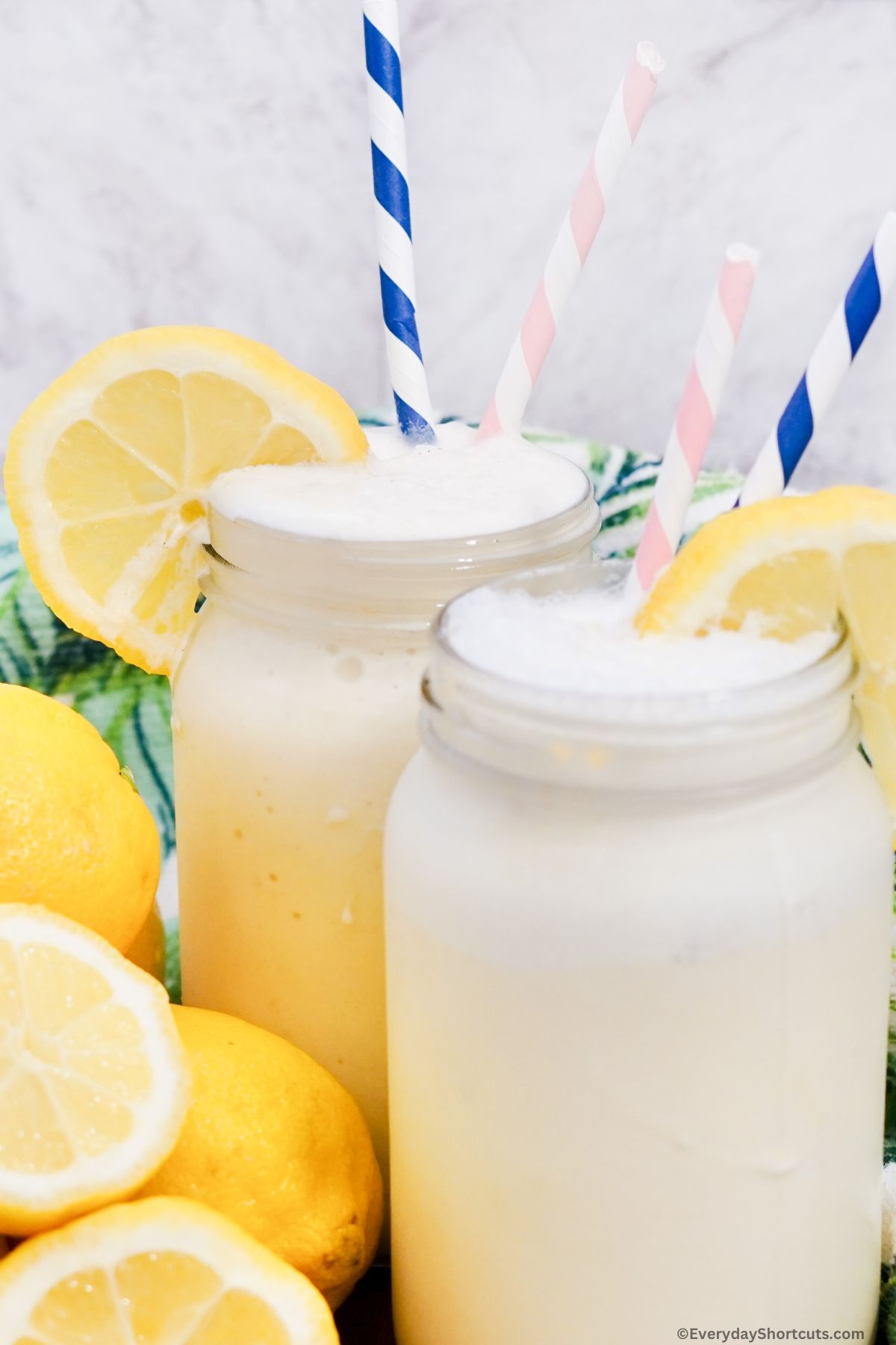 frosted lemonade in a frosty glass with a lemon slice