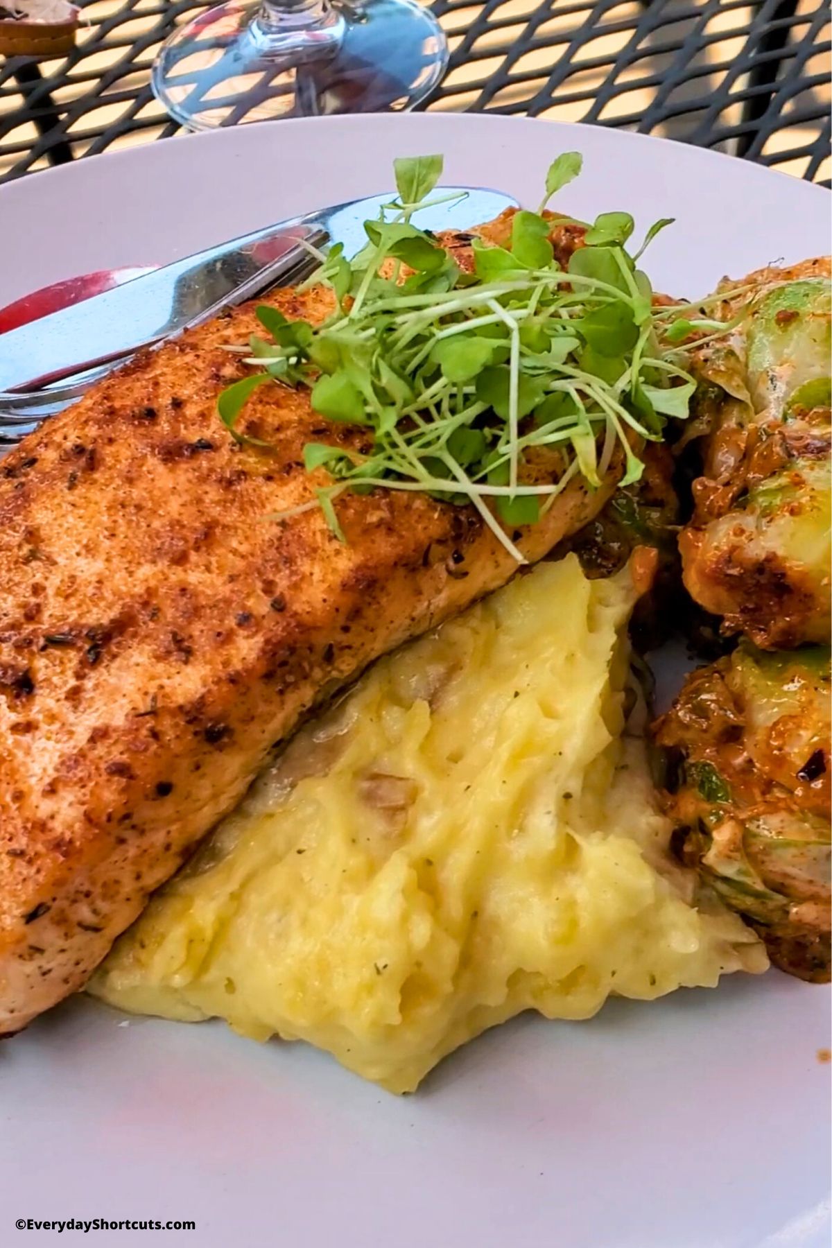 salmon dinner with mashed potatoes and brussels sprouts