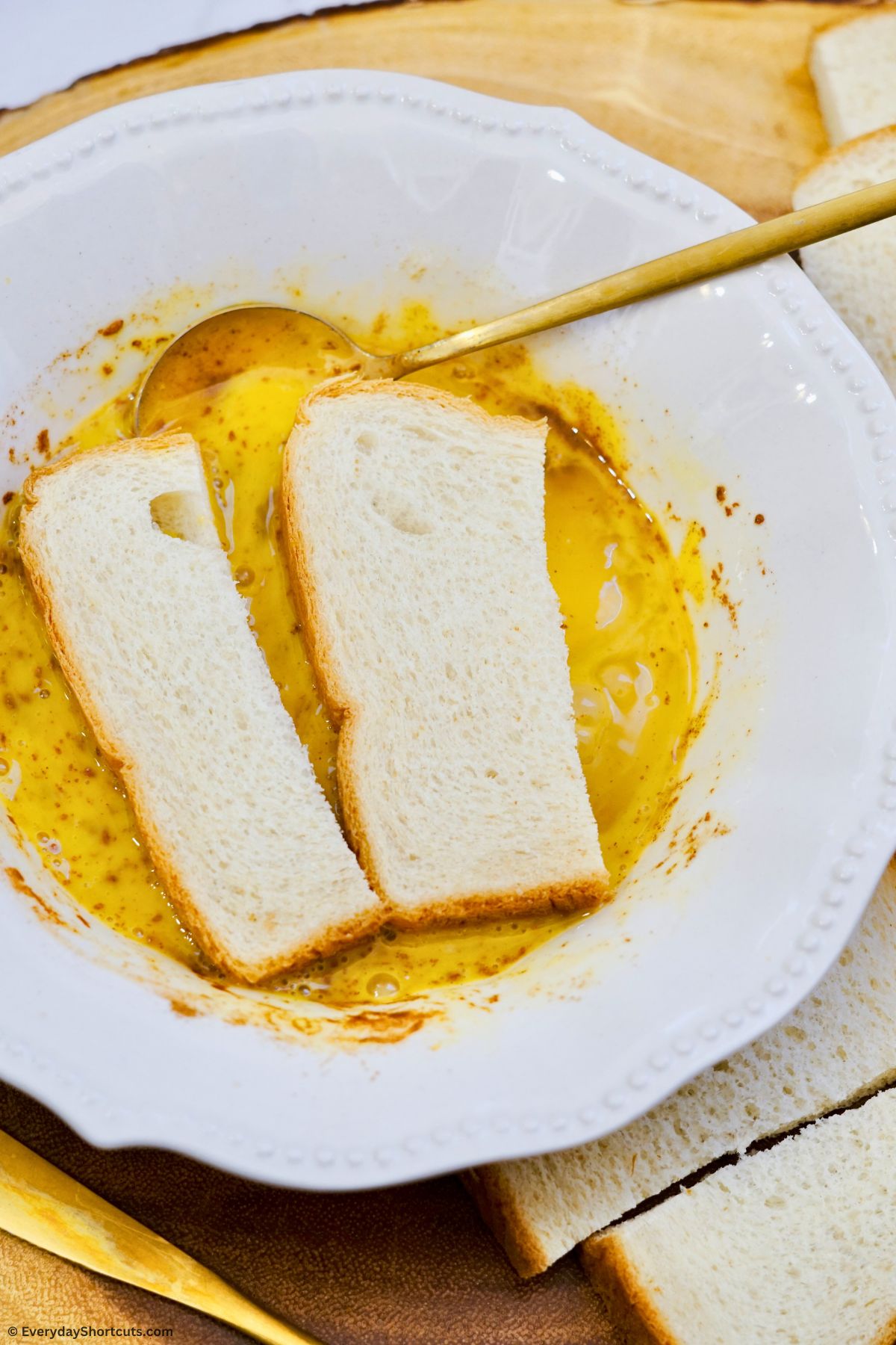 dip bread sticks into egg batter