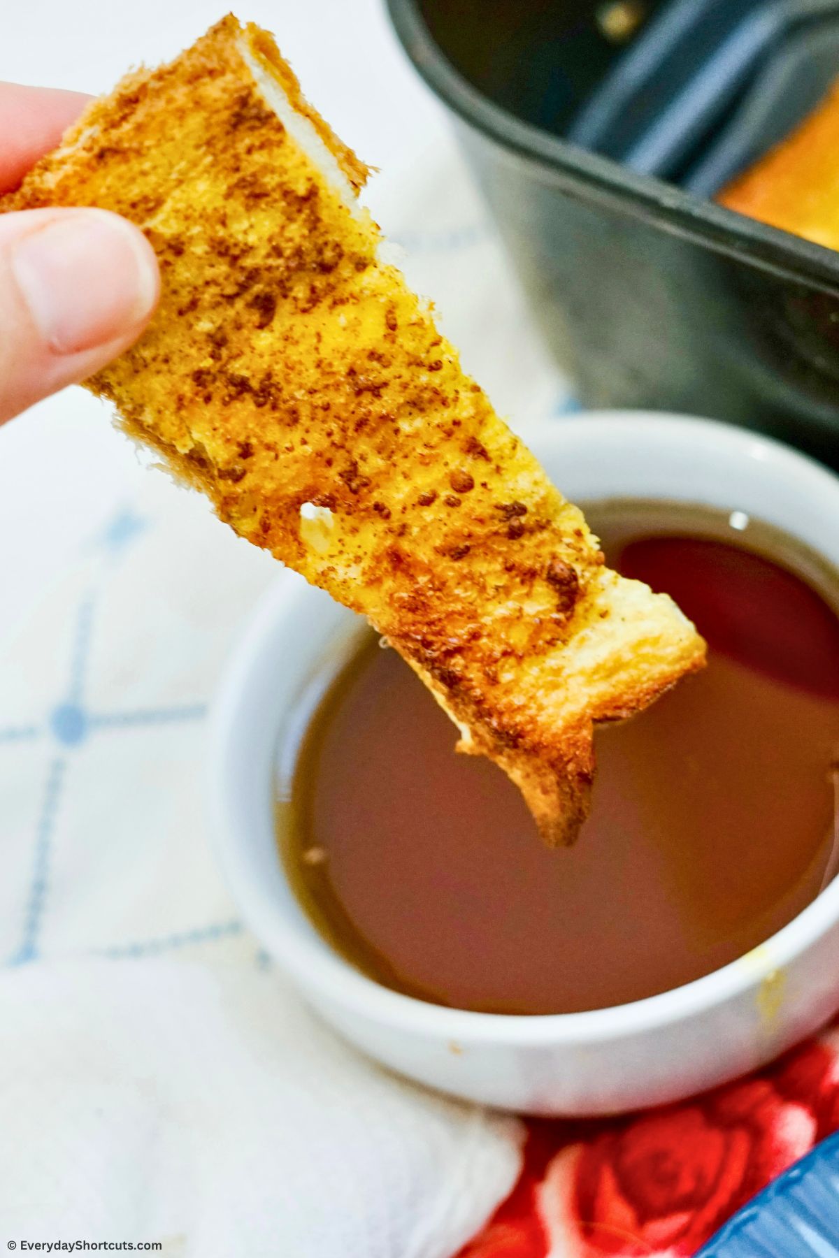 homemade french toast sticks dipped in syrup