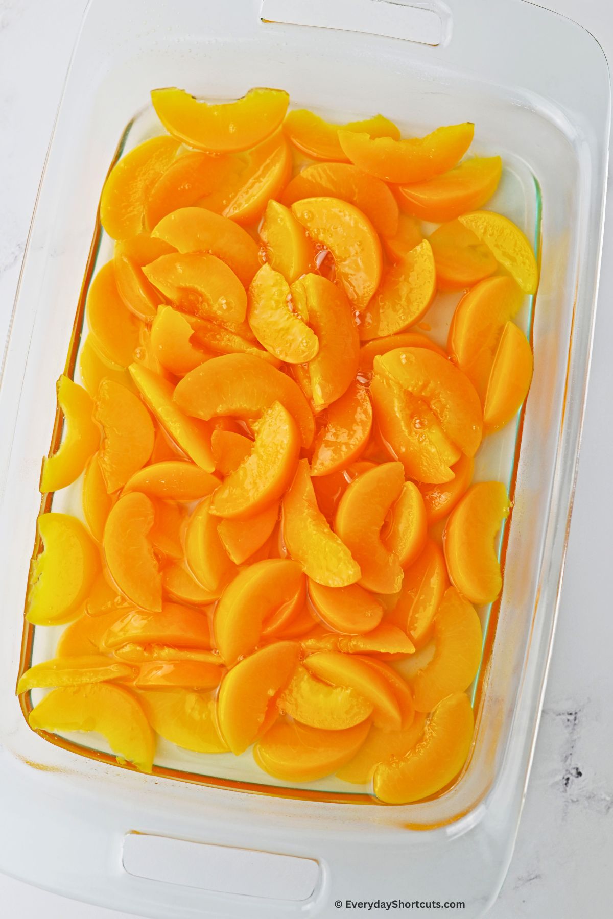 peach slices in a baking dish