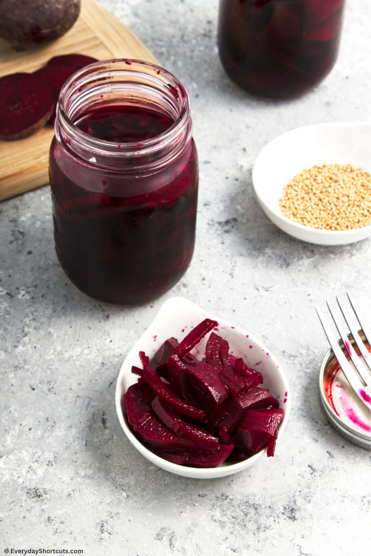beets in a bowl and a mason jar on counter