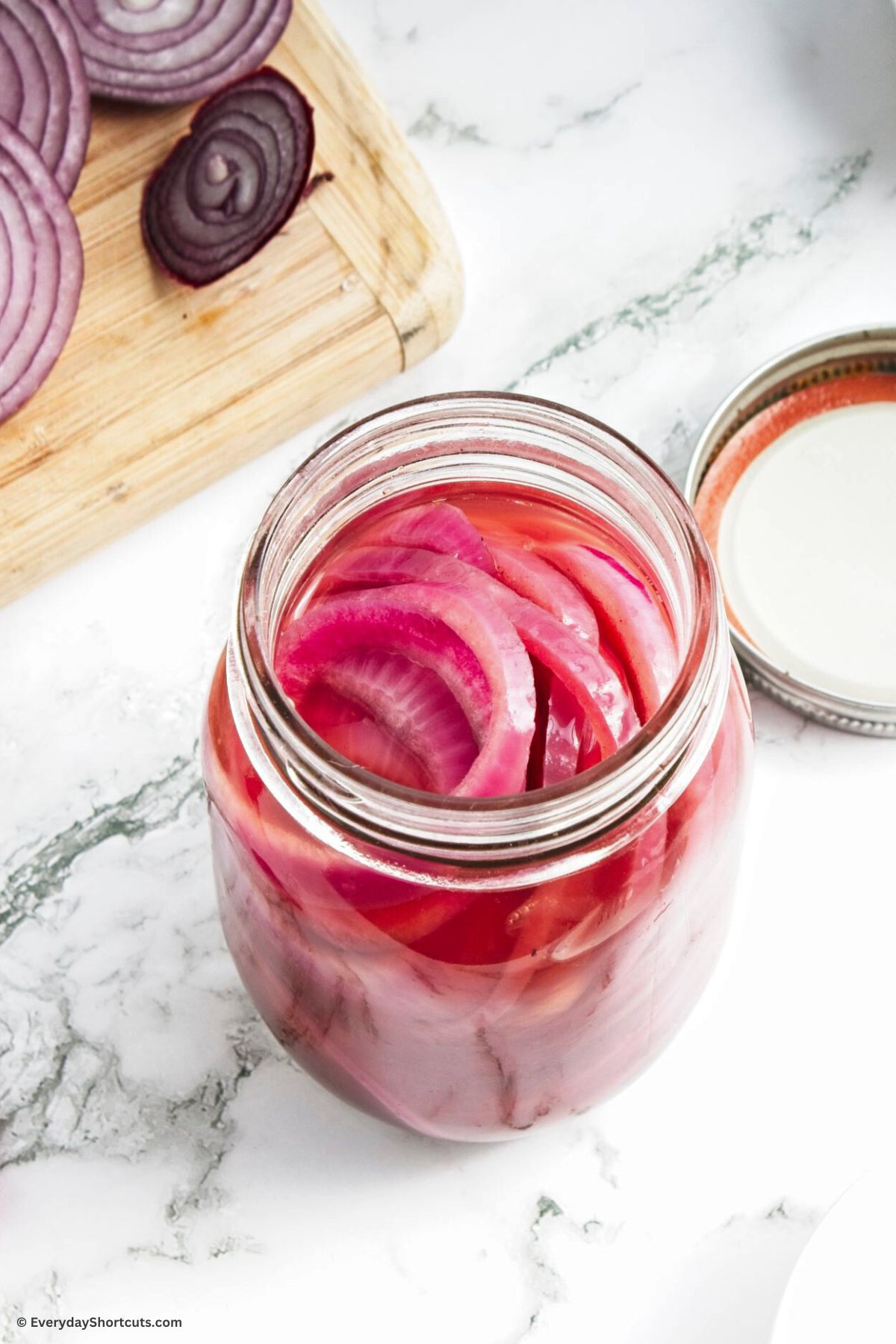 onions marinated with pickling mixture in a jar