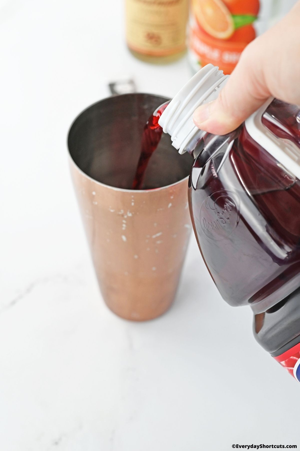 add cranberry juice to a cocktail shaker