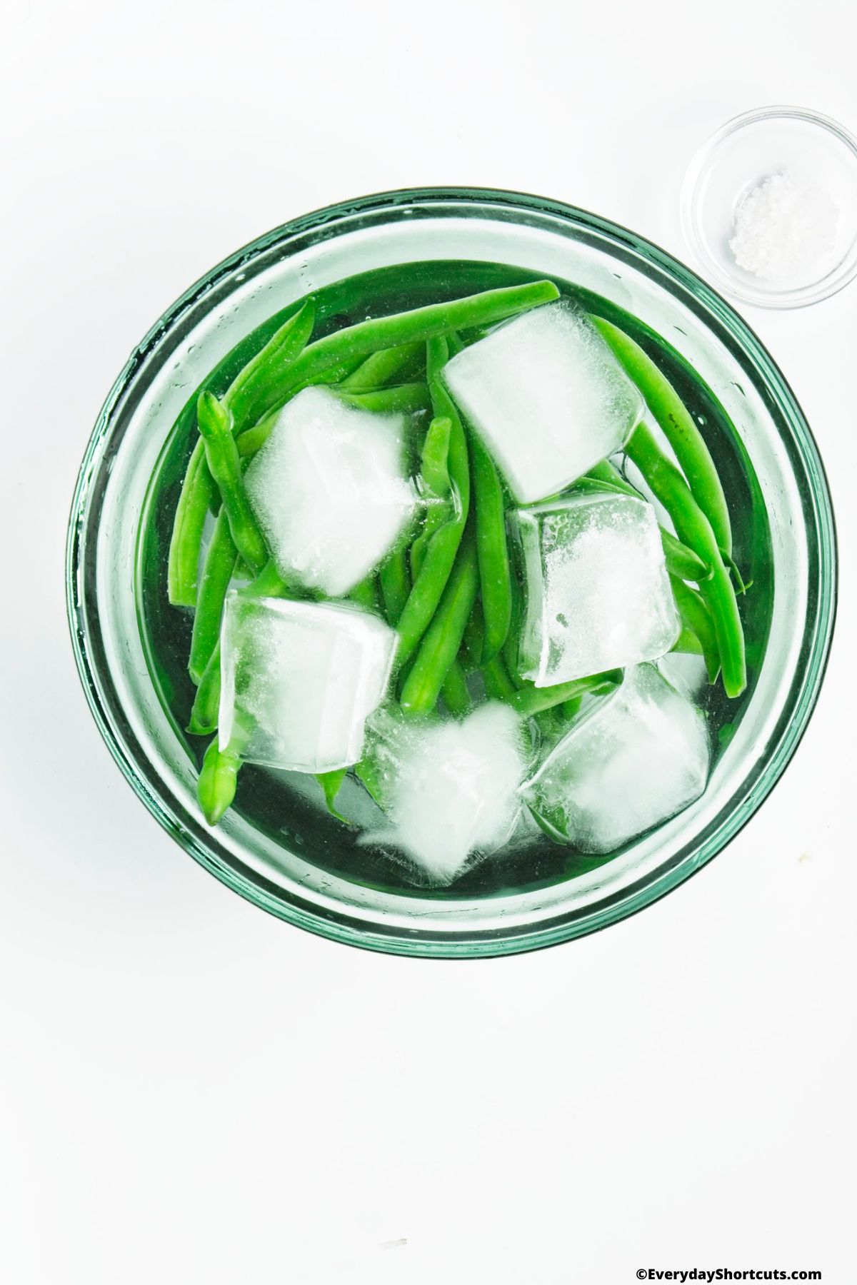 ice cube in a bowl with green beans