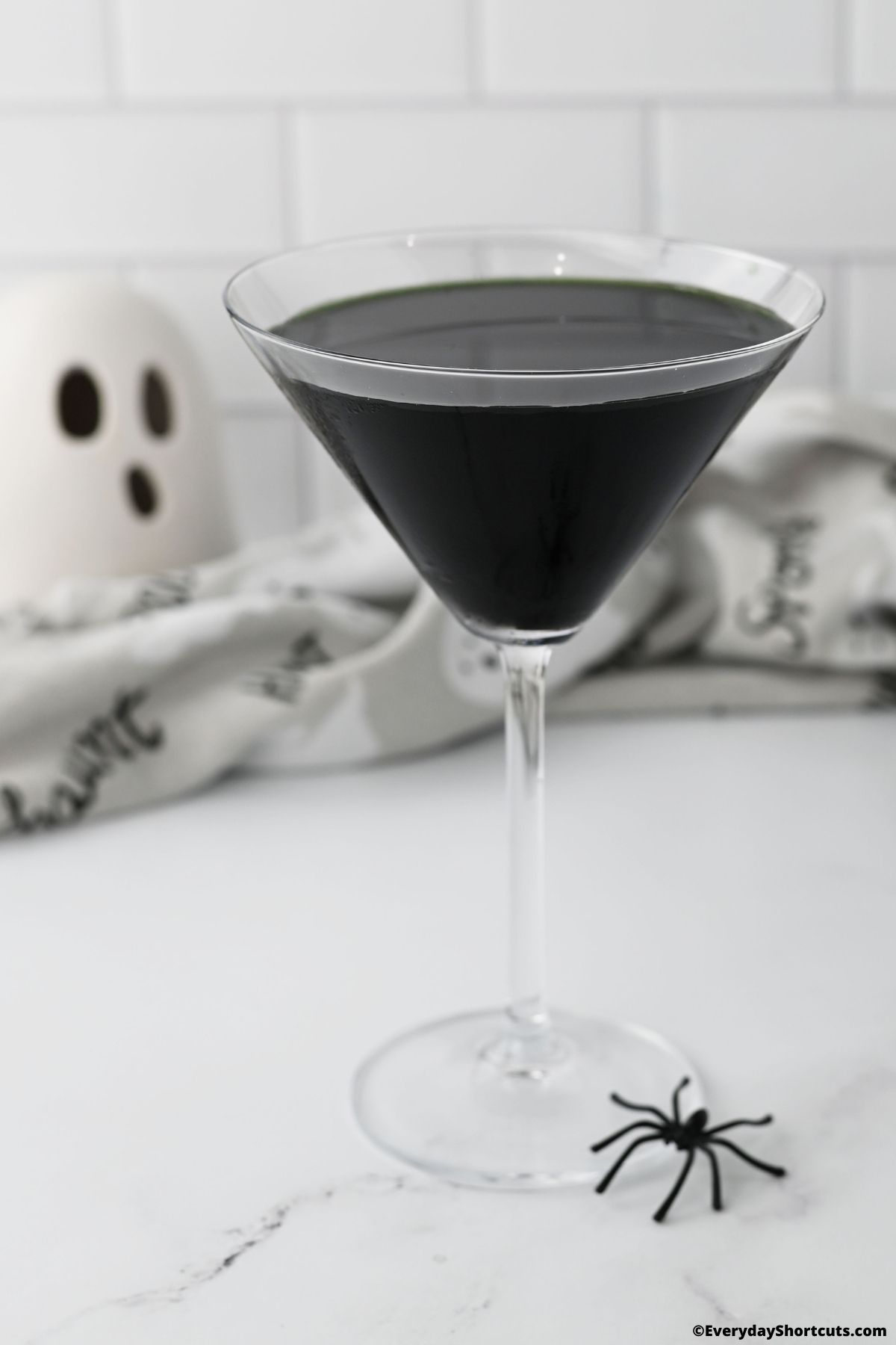 black martini in a martini glass