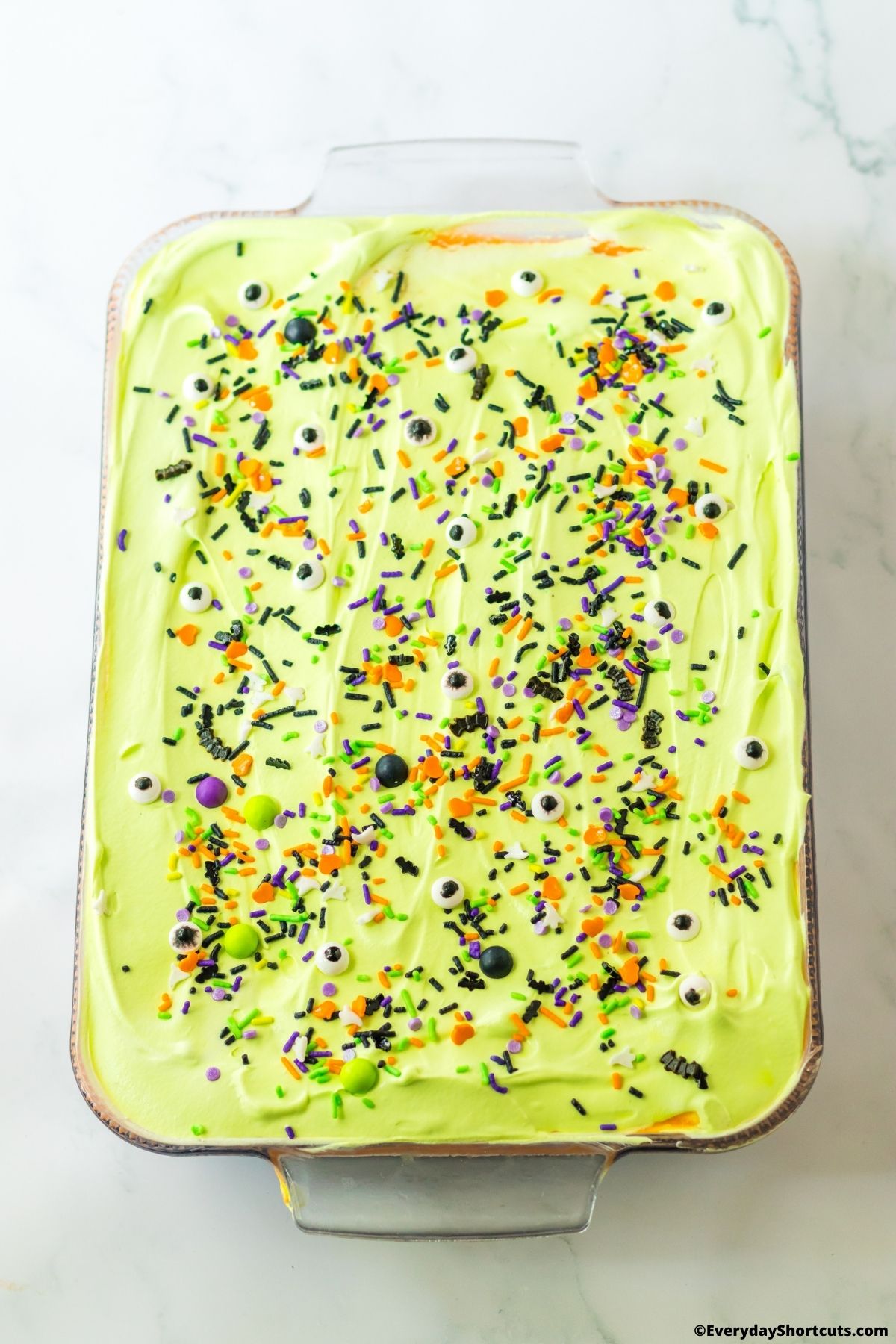 green whipped topping layer in a baking dish