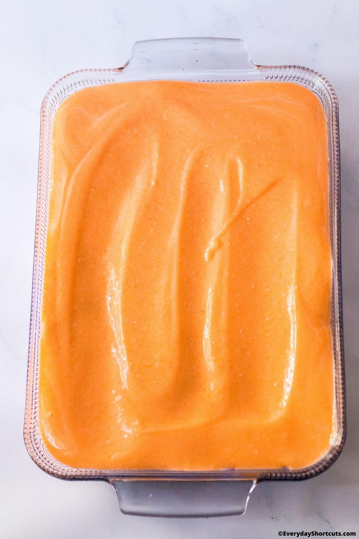 orange gelatin layer in a baking dish