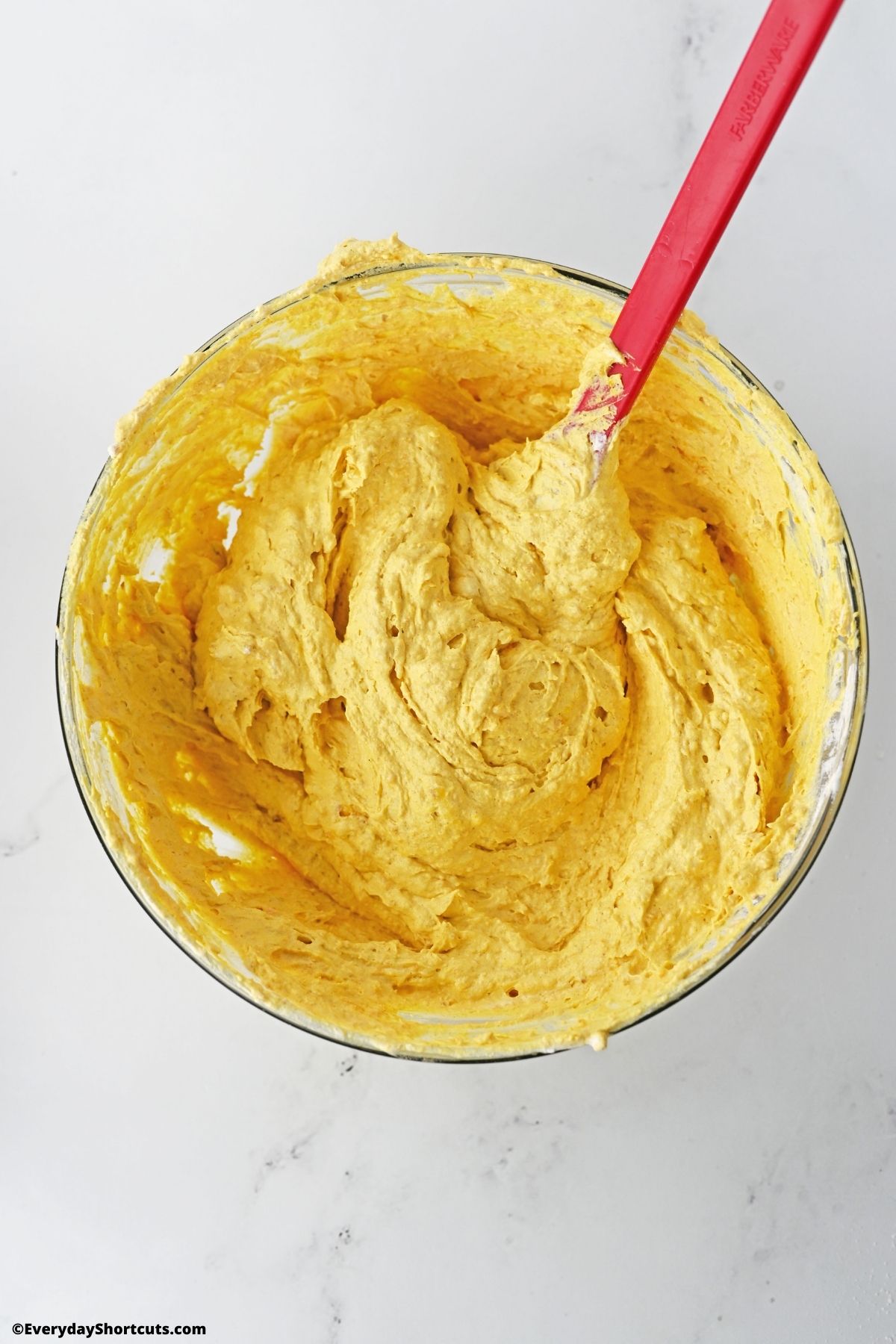 pumpkin dip ingredients in a bowl mixed together