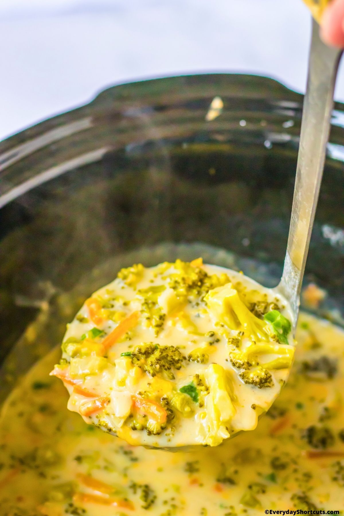 broccoli cheddar soup on a ladle