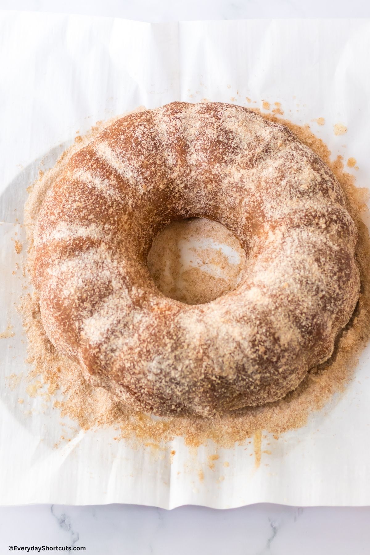 cinnamon sugar topping on apple donut bundt cake