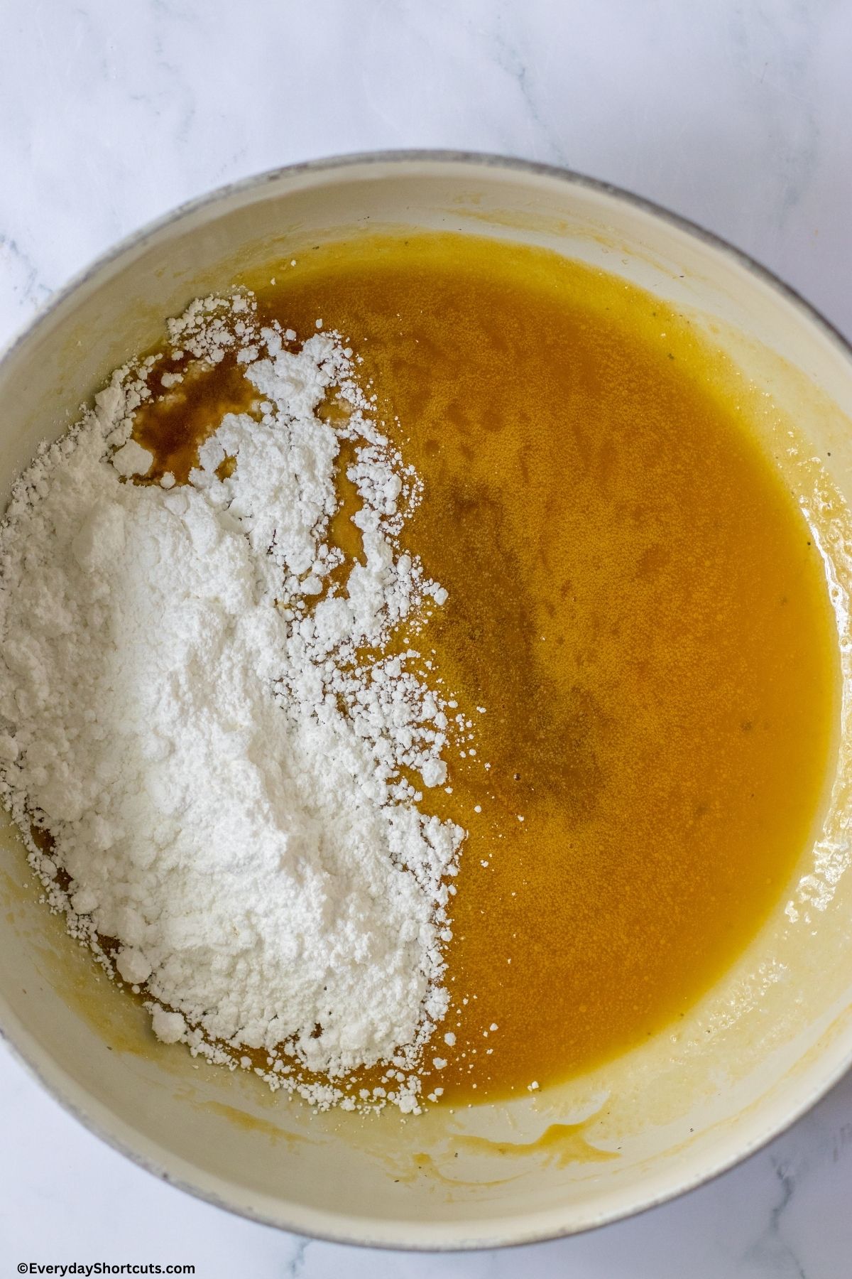 caramel icing ingredients in a pan