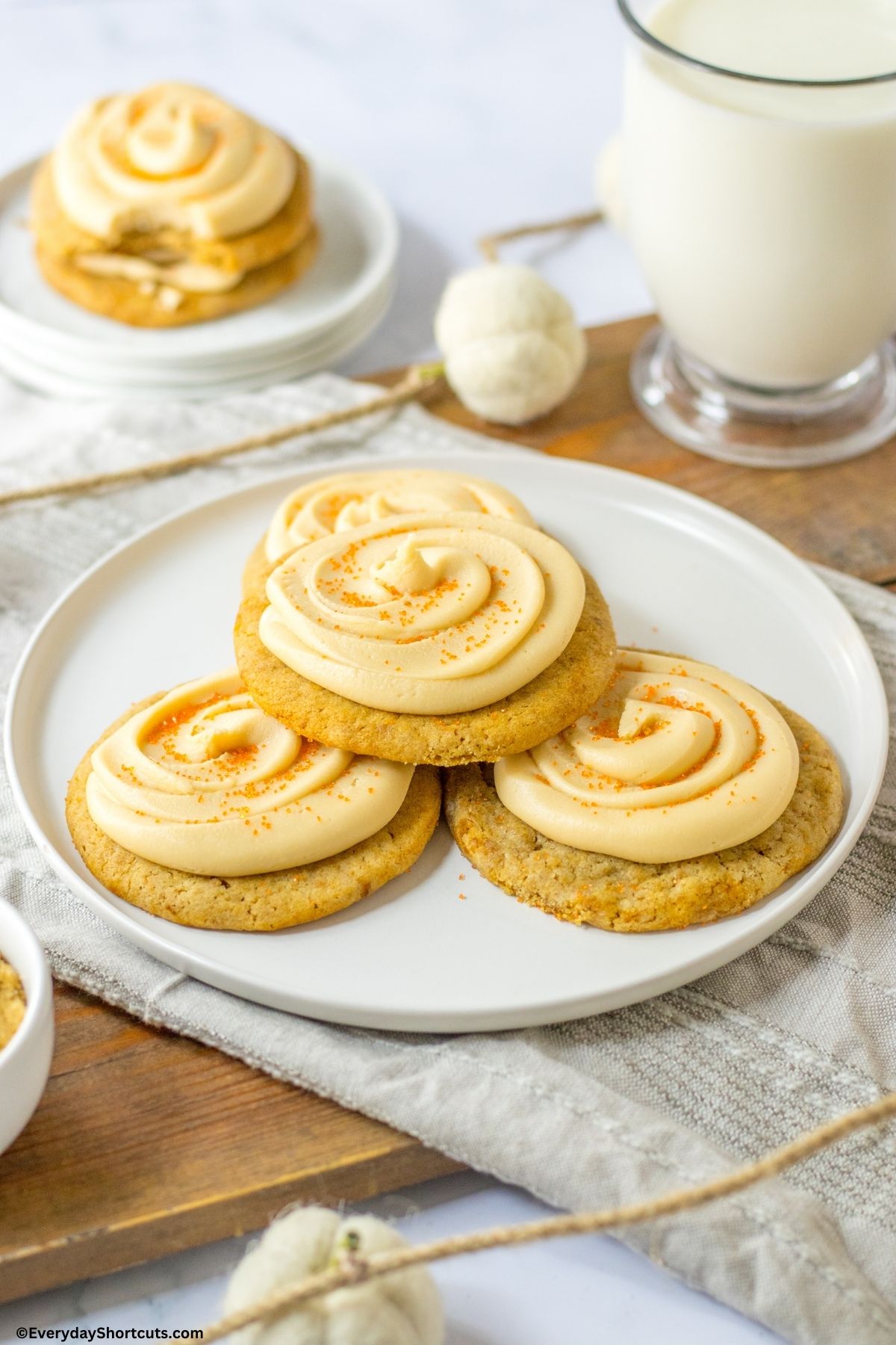 apple cookies with caramel icing on a plate