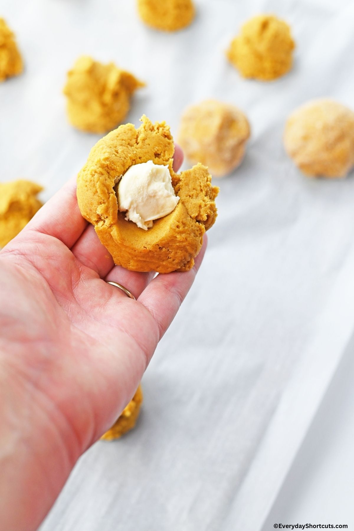 pumpkin cookies with cheesecake drops in the middle