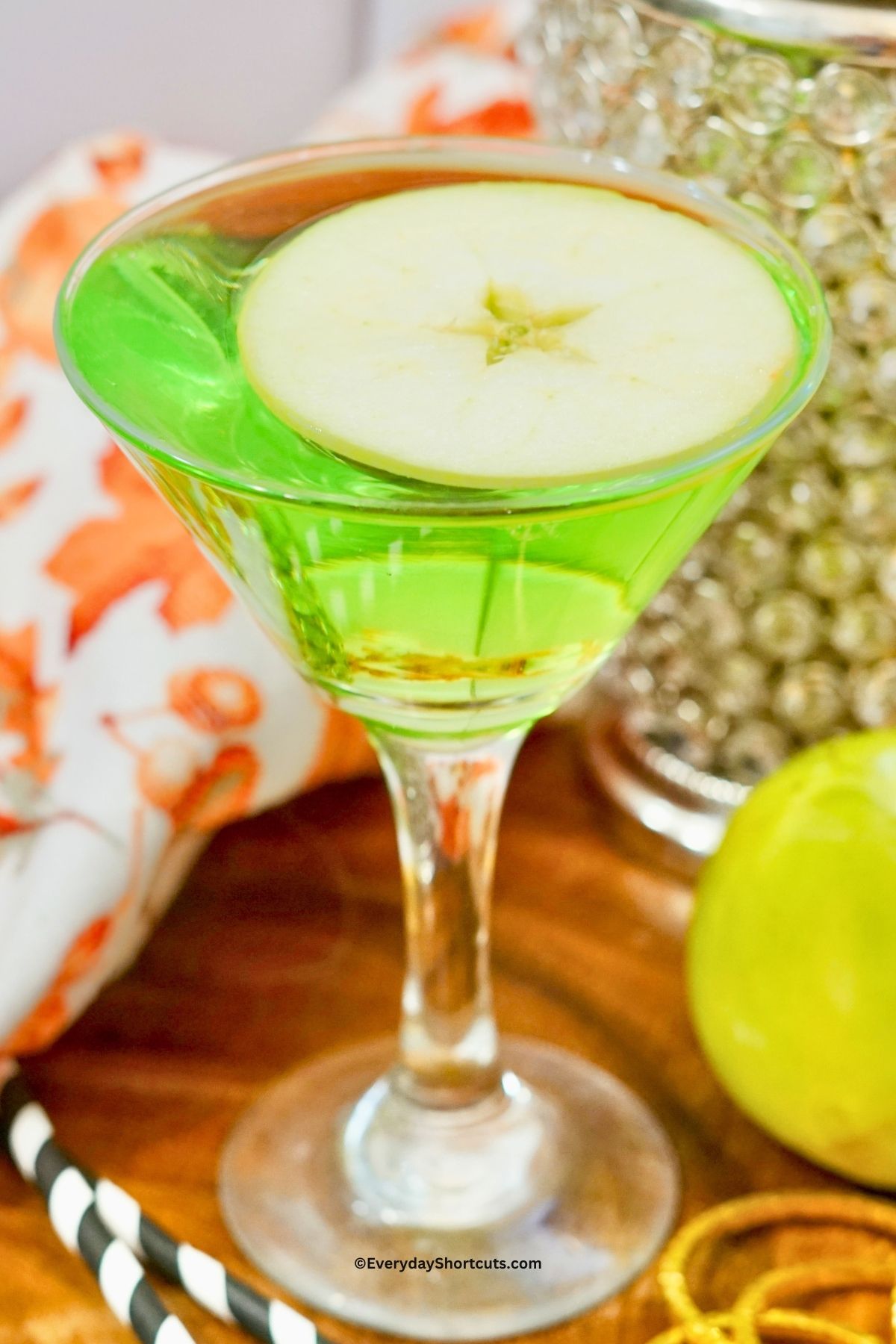 sour apple martini in a martini glass
