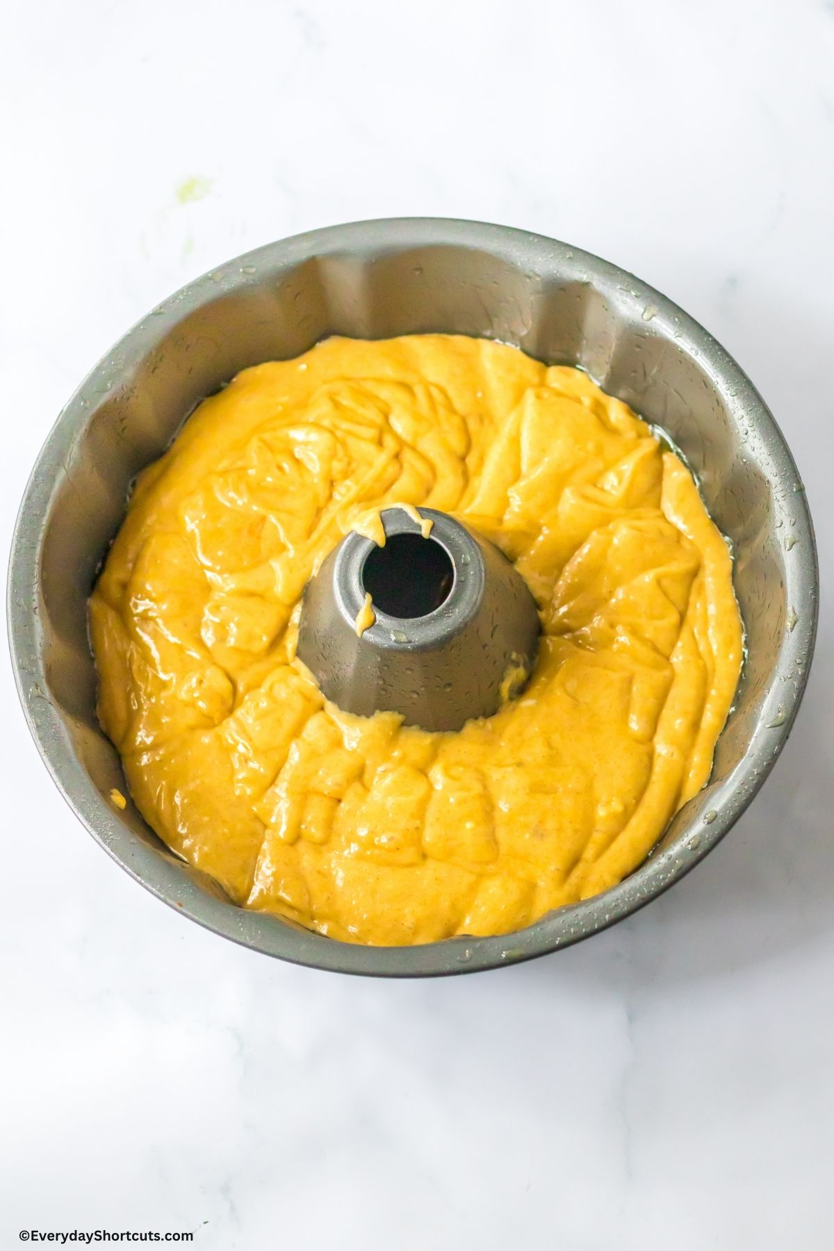 yellow cake batter in a bundt pan