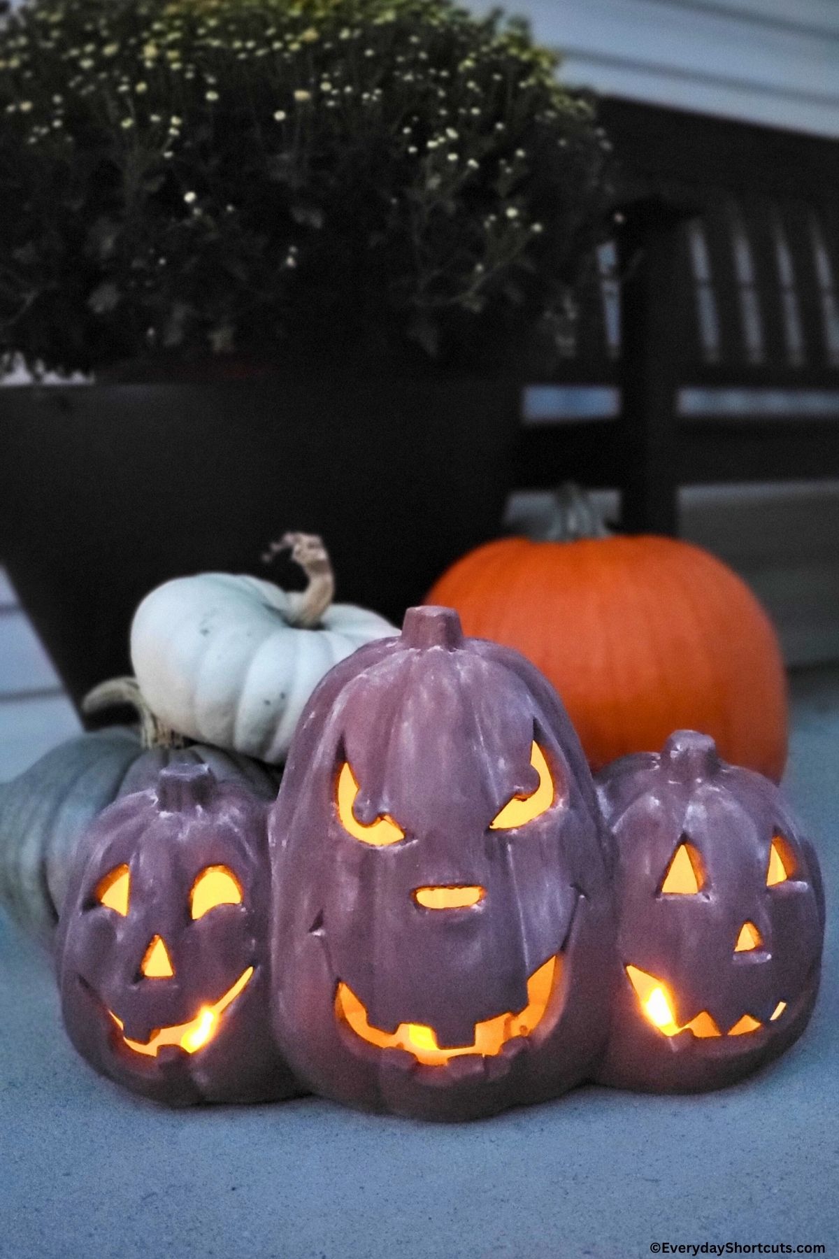 terracotta pumpkins lit up at night