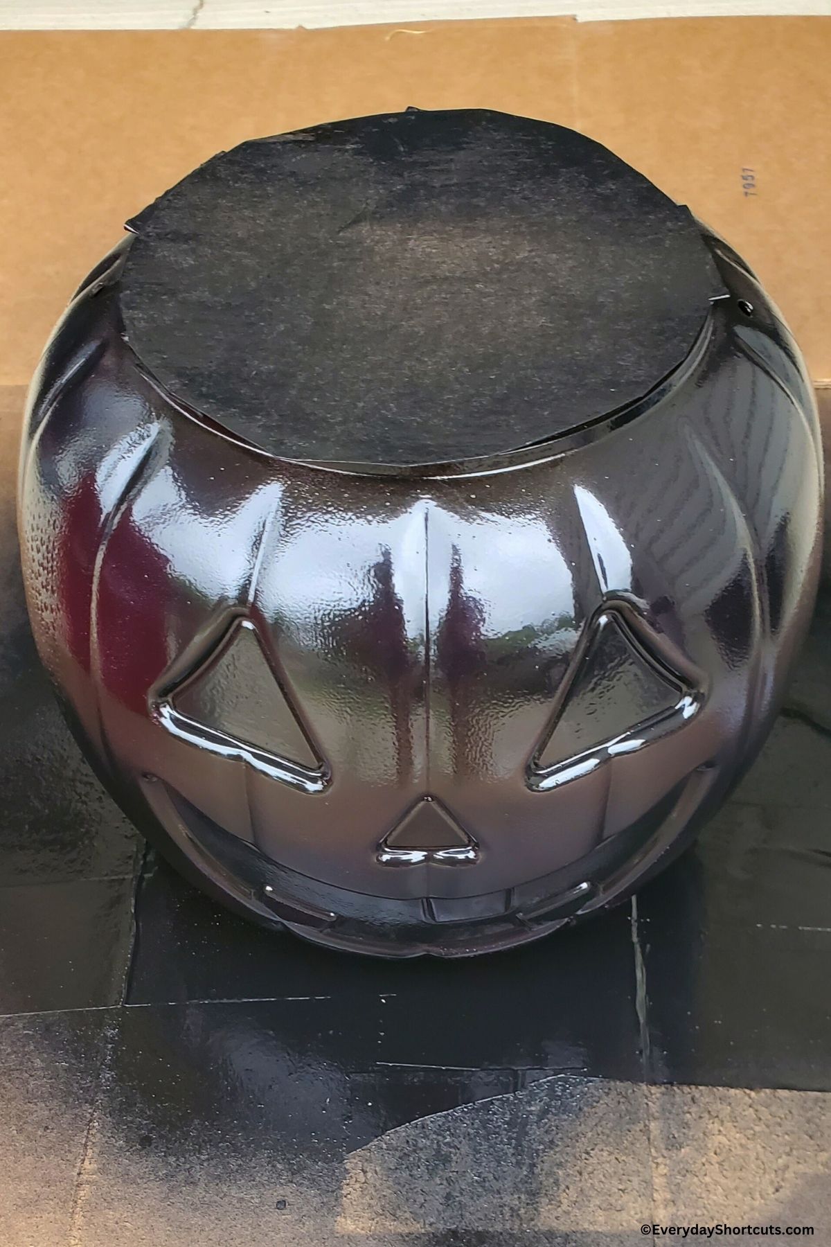 plastic pumpkin spray painted black