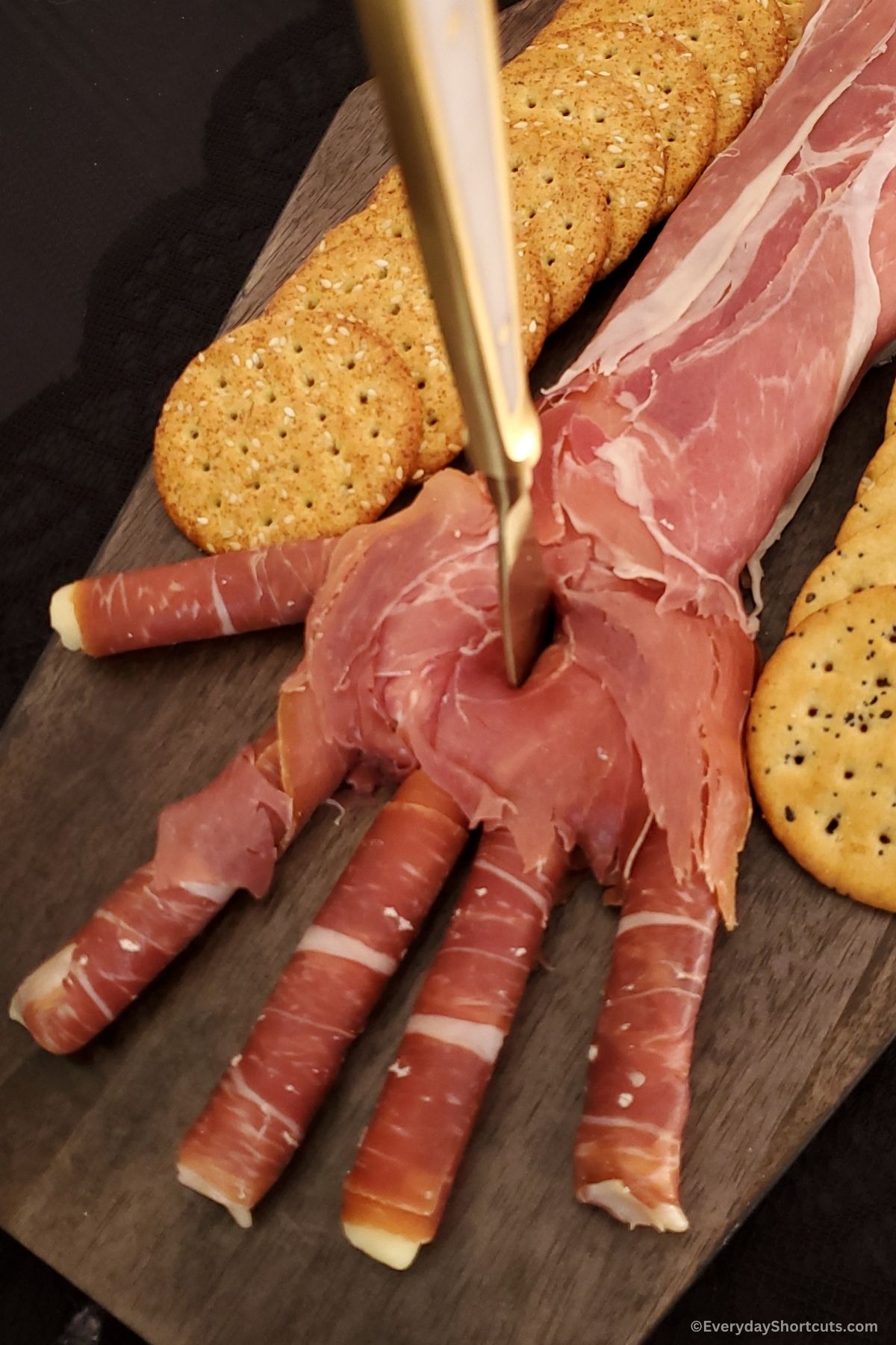 Halloween hand on a platter with crackers
