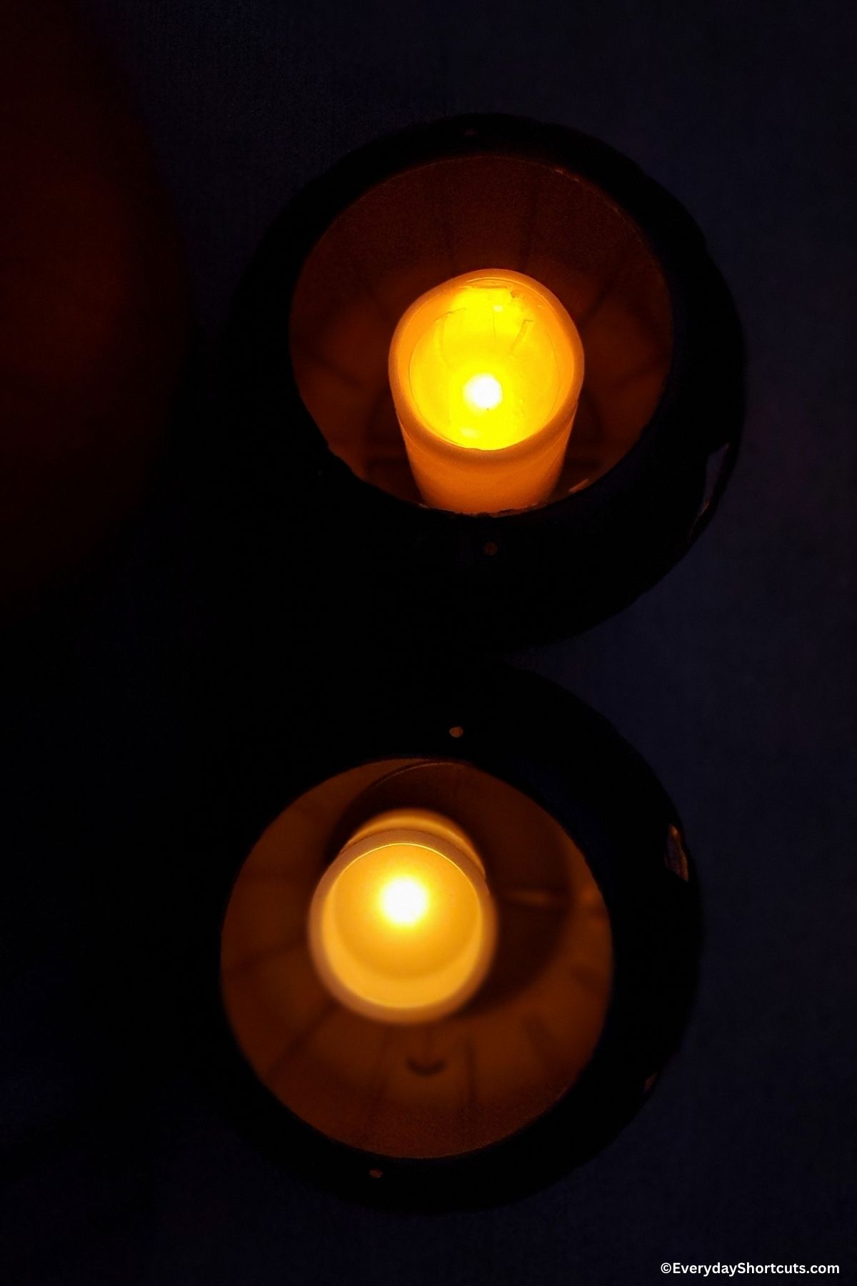 large battery operated candles inside of plastic pumpkins