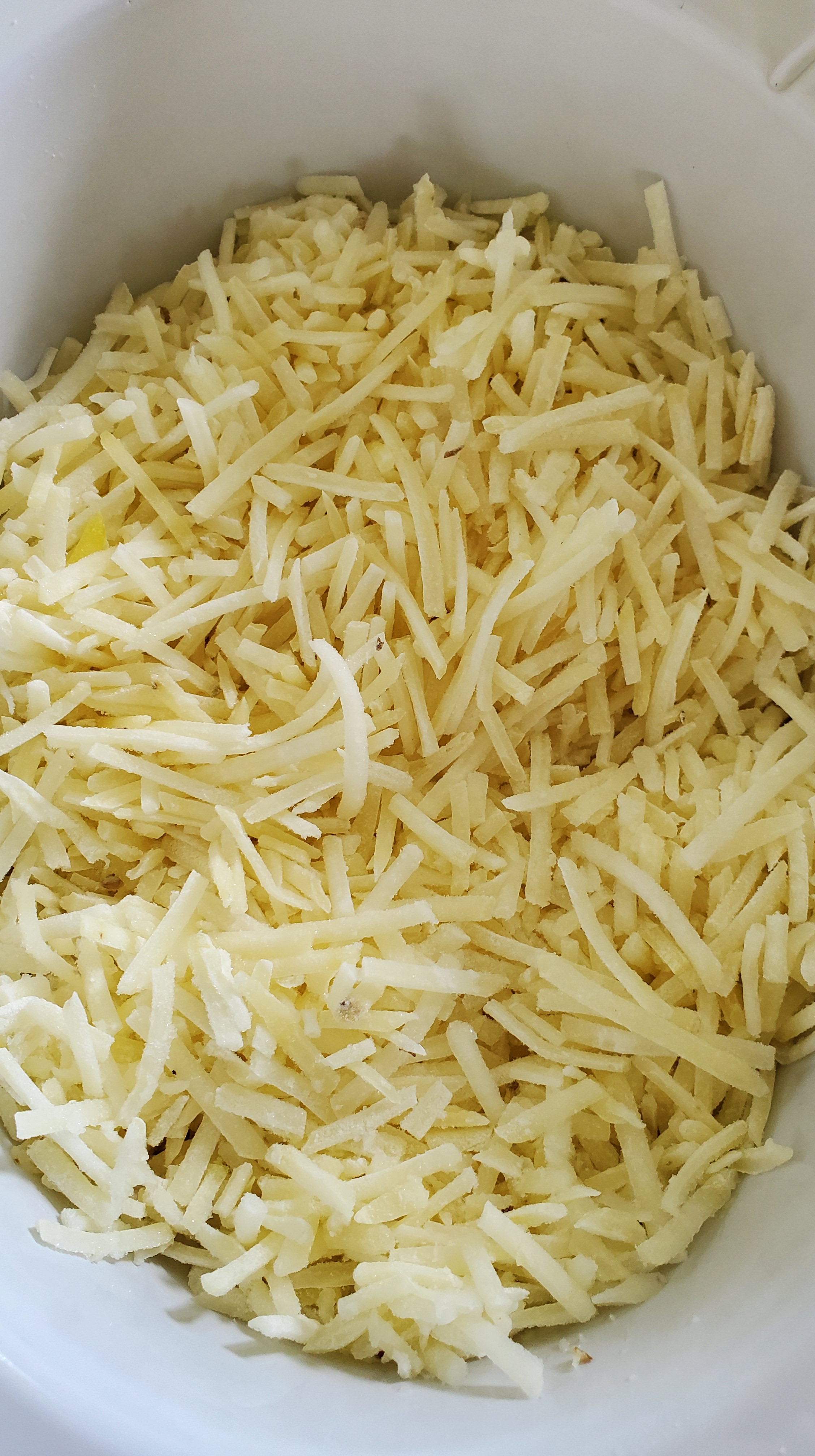 shredded hashbrowns in a slow cooker