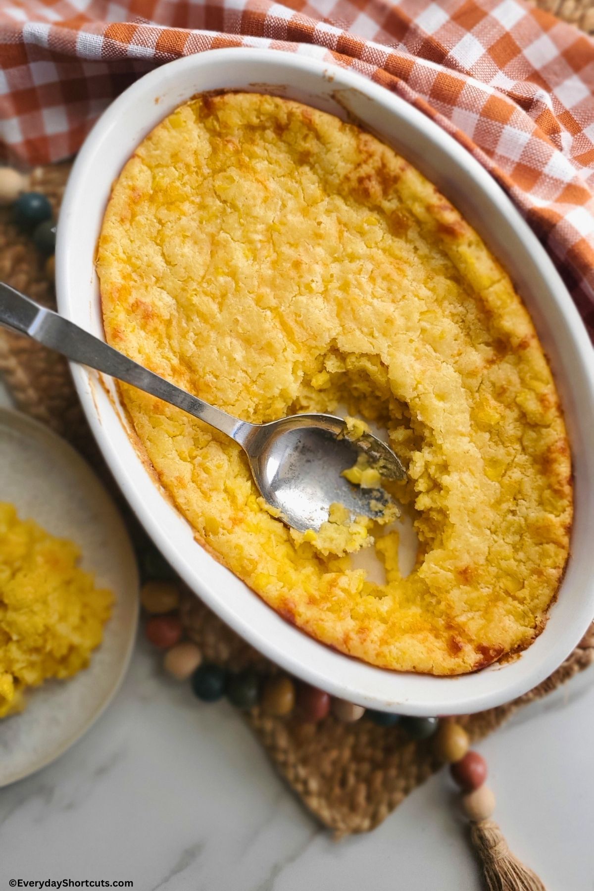 corn casserole with a scoop taken out of it