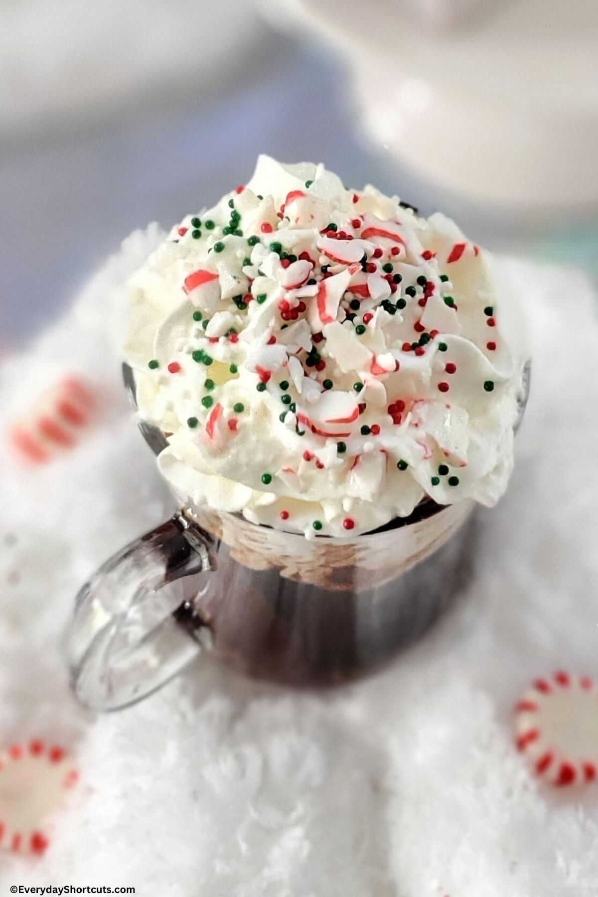 peppermint coffee cocktail with sprinkles and crushed peppermints