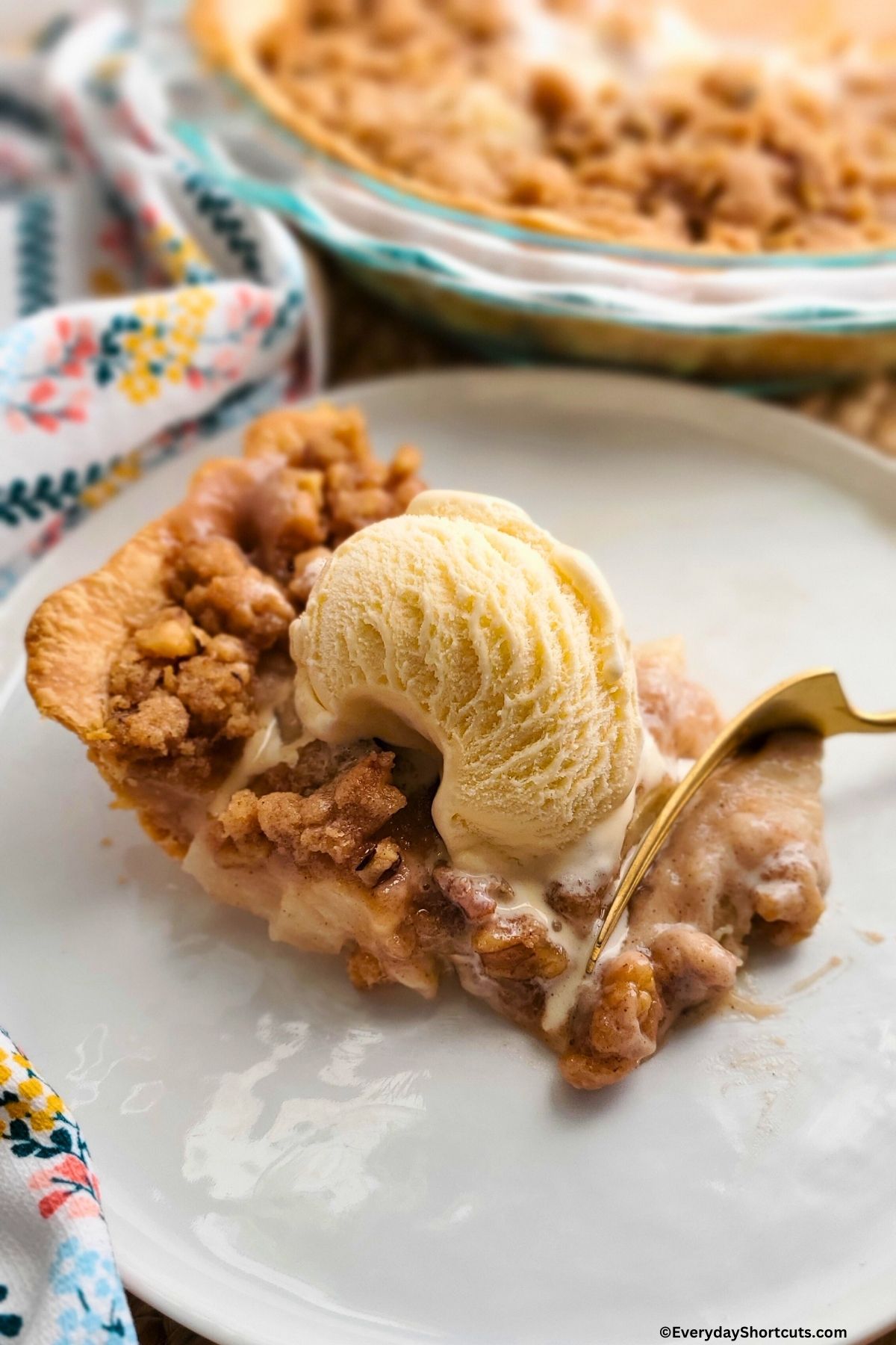 slice of sour cream apple pie with walnut streusel