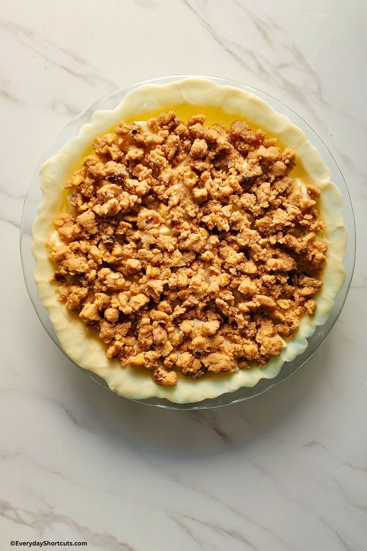 apples and walnut streusel in a pie crust