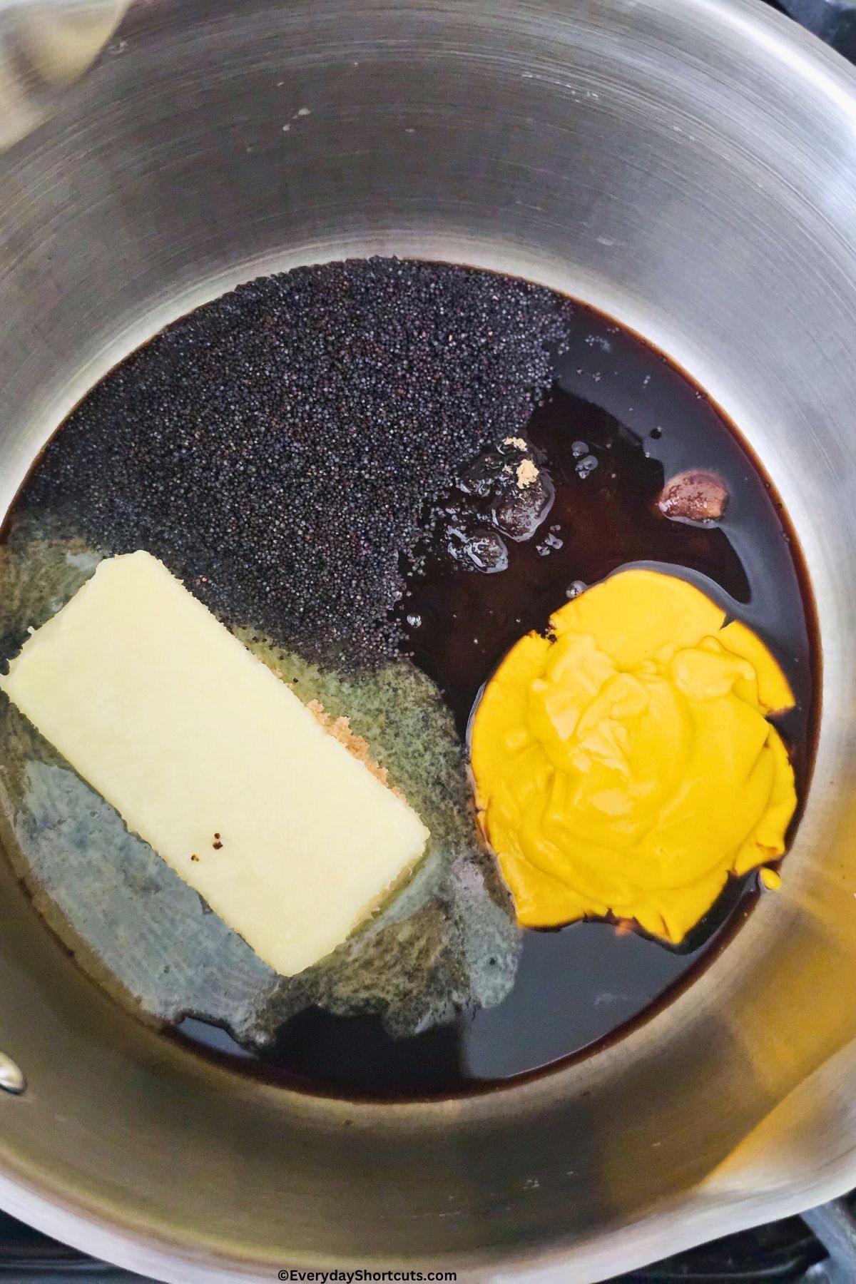 butter poppy seed sauce melting in a saucepan