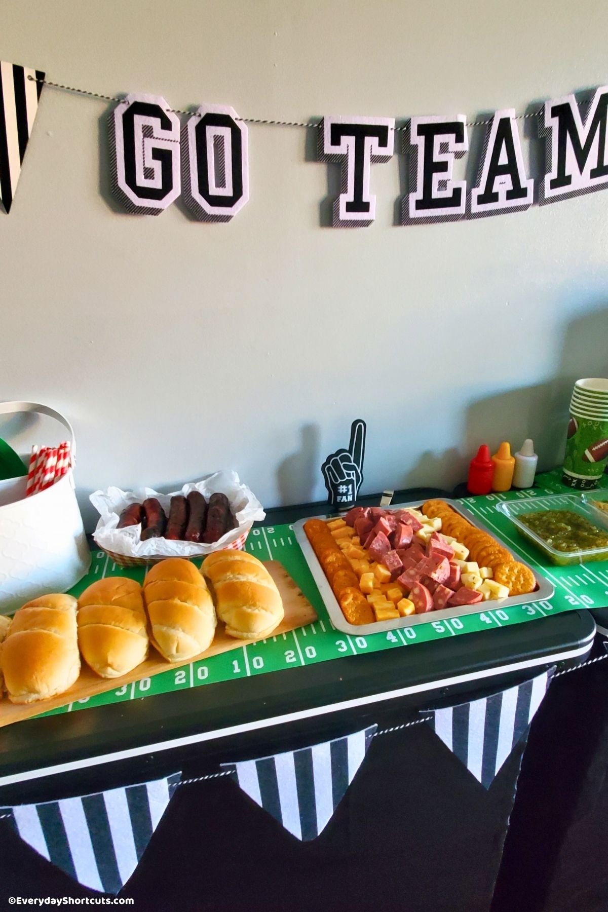 brats and snacks on a football party bar