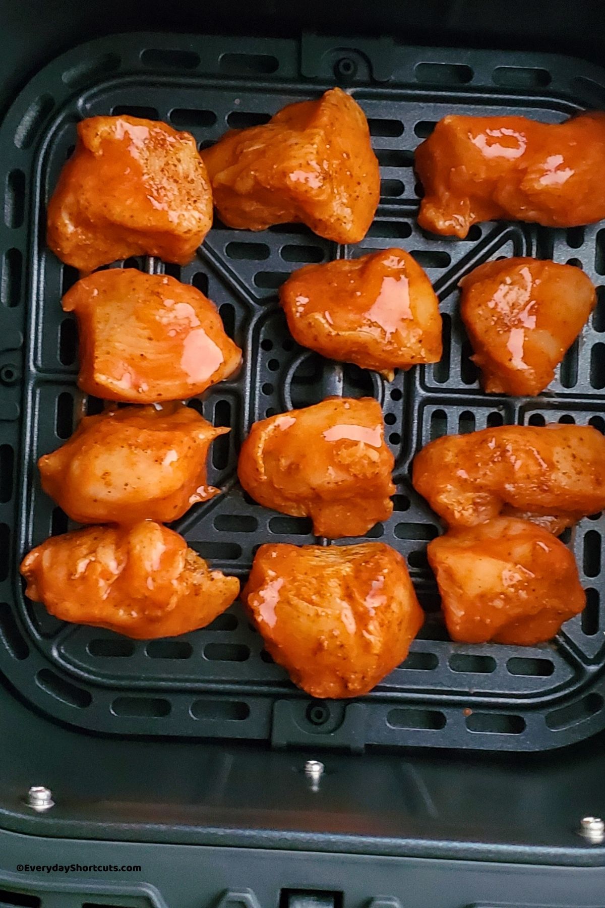 chicken chunks in a single layer in the air fryer