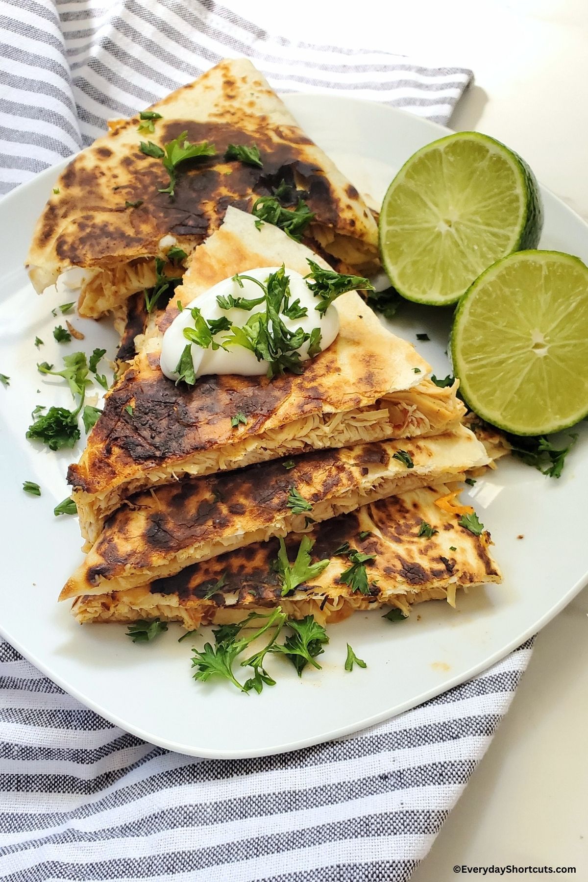 chicken quesadillas with sour cream on top