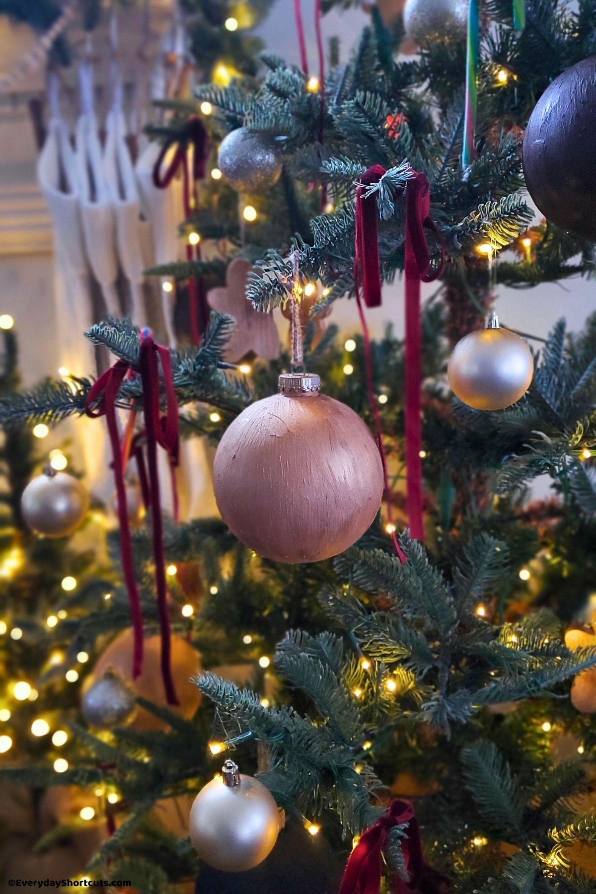 gold textured ornament on a Christmas tree