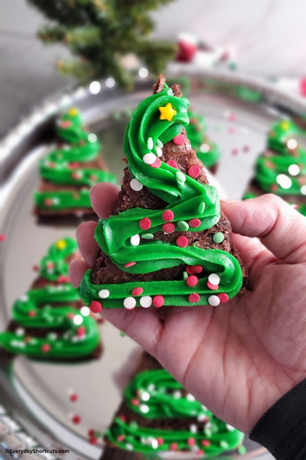 holding a Christmas tree brownie