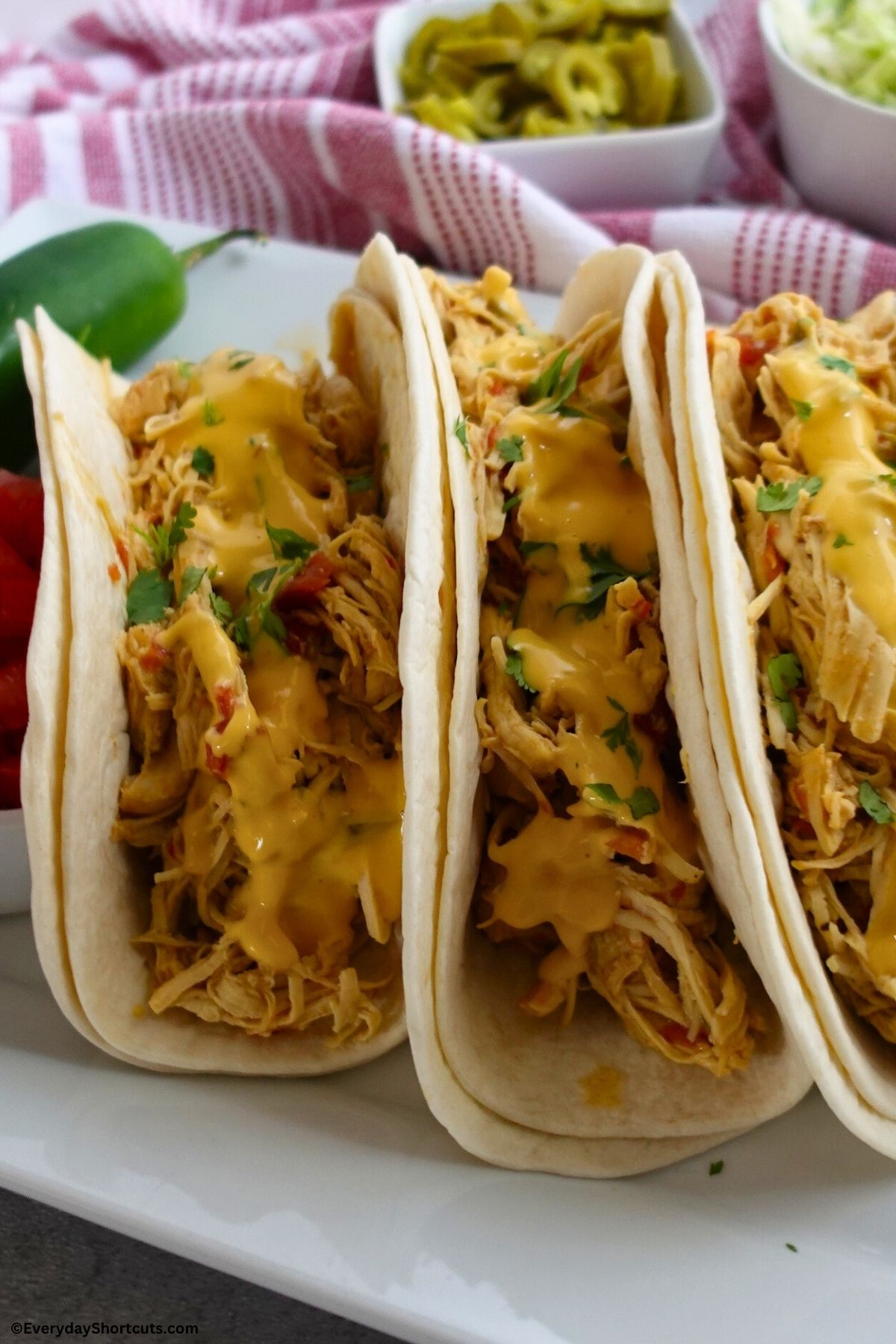 queso chicken tacos on a plate